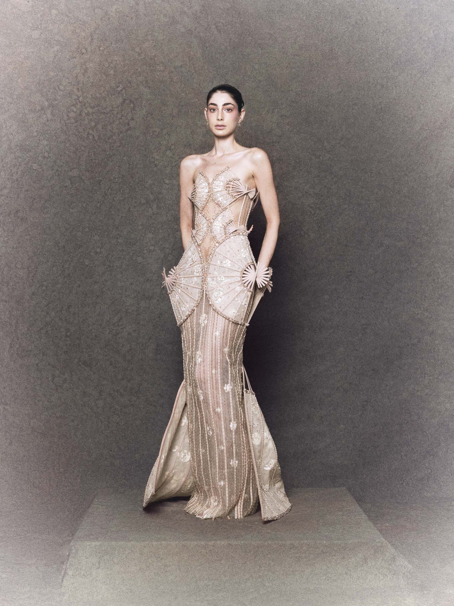 Nude organza strapless gown with hand-embroidered flowers, butterflies, and crystals