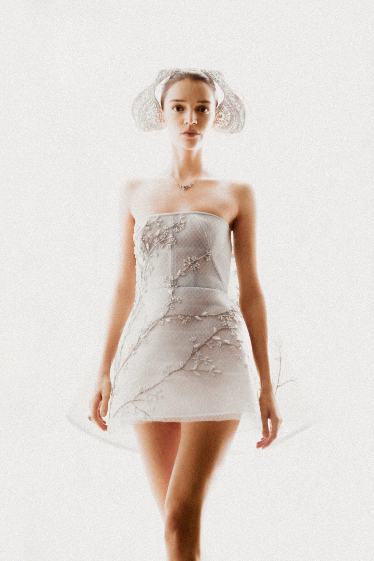 Strapless mini dress with high-low cape in silvery grey