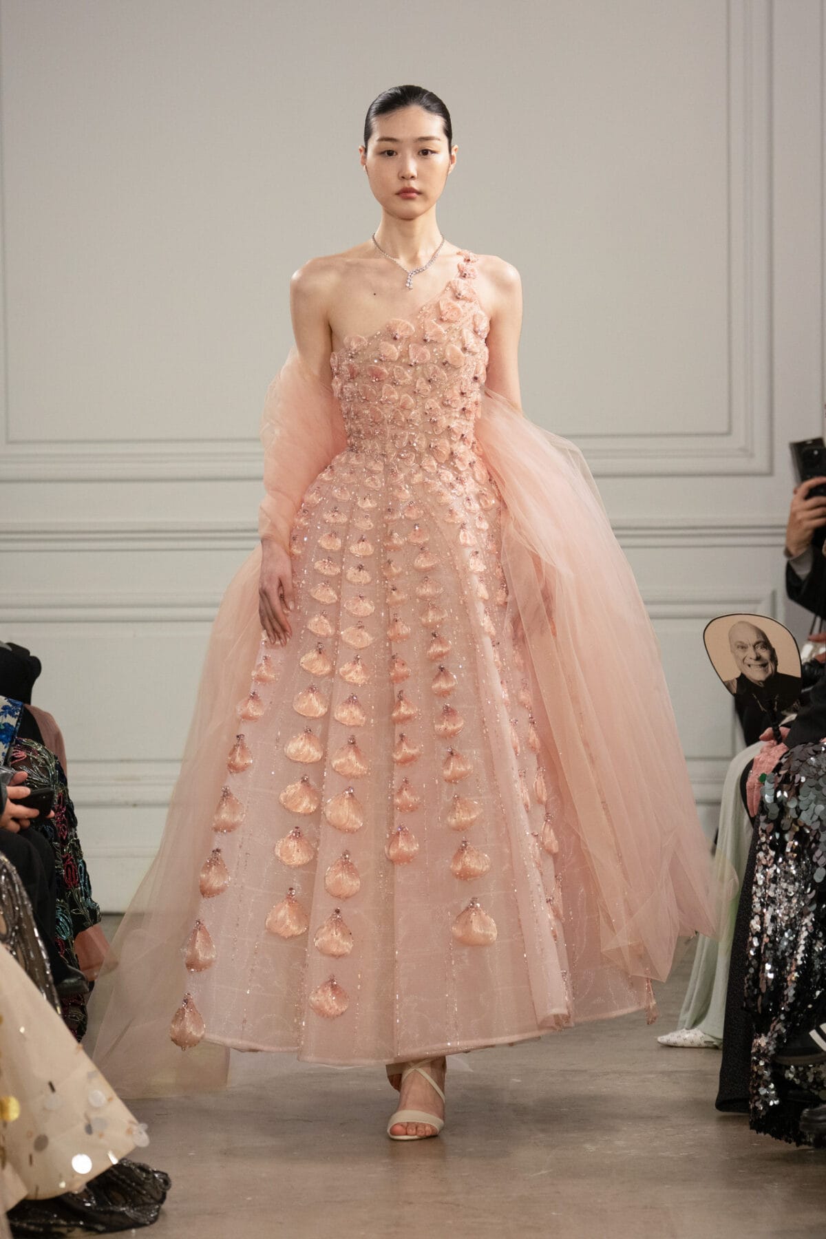 One-shoulder blush pink ball gown with 3D floral appliqué