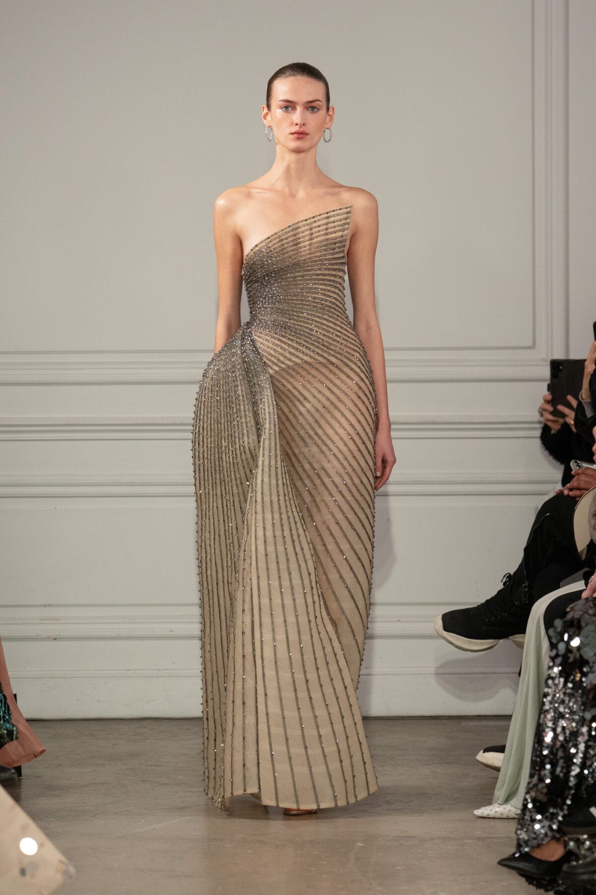 Strapless asymmetric column gown in taupe