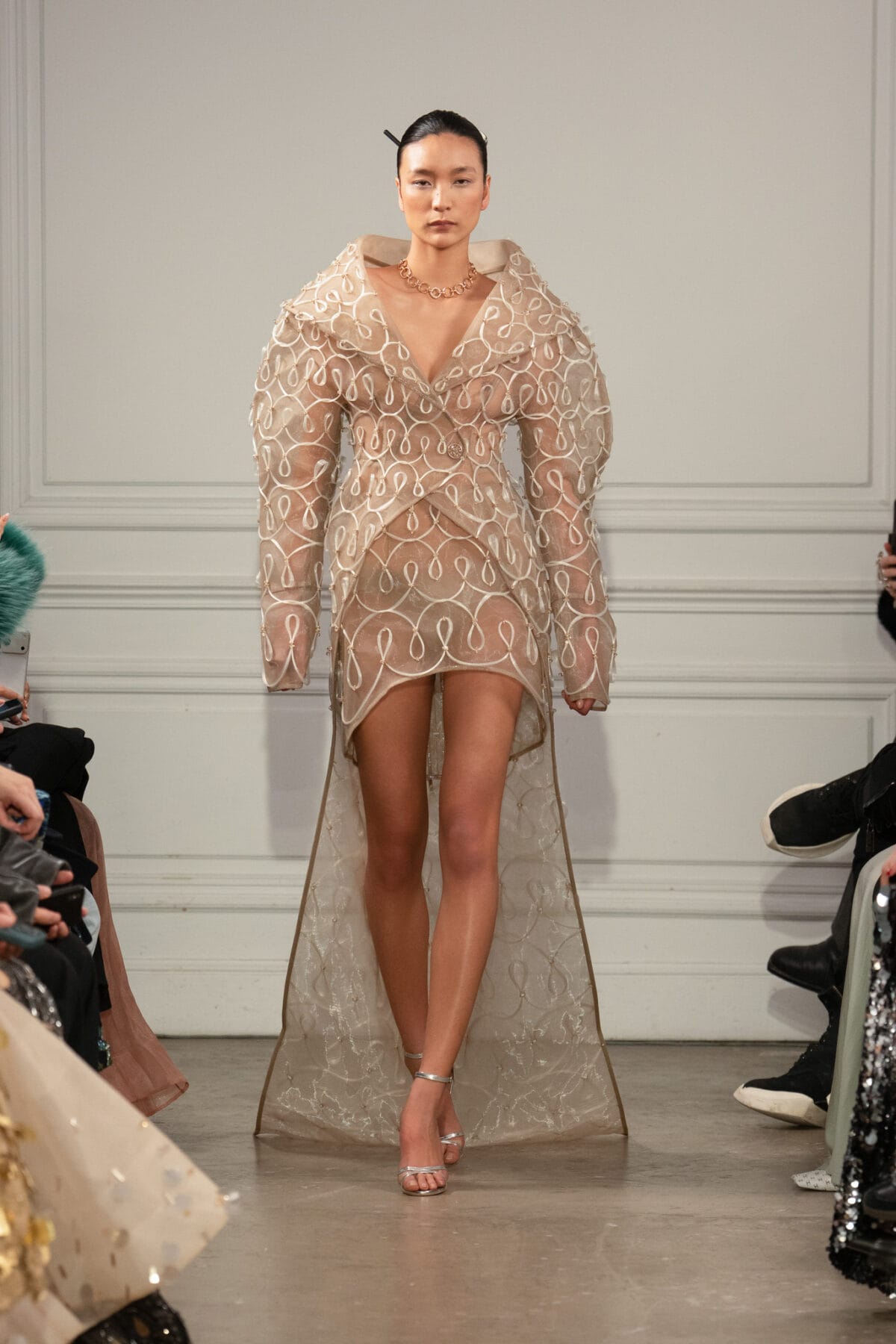 Tailored coat and miniskirt ensemble in warm nude