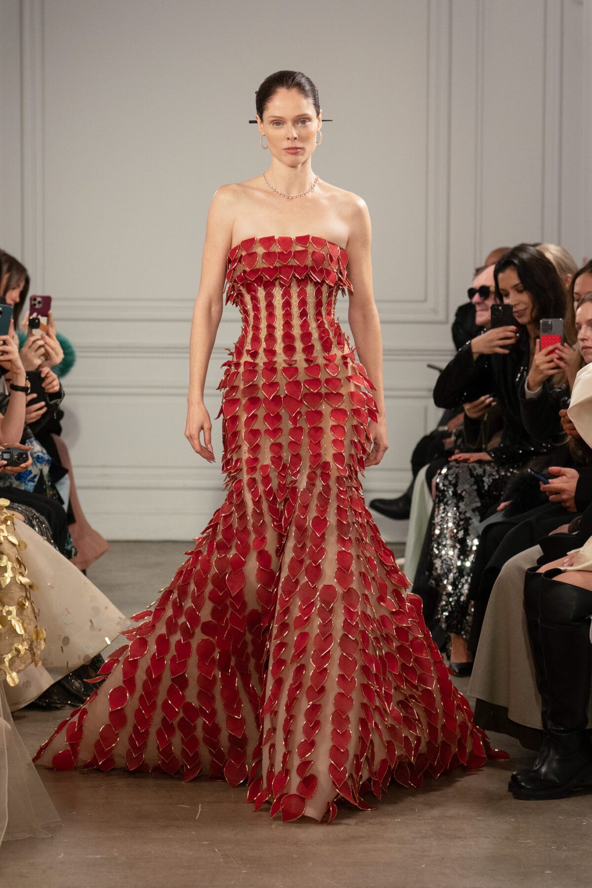 Strapless floor-length trumpet gown with crimson chiffon leaves