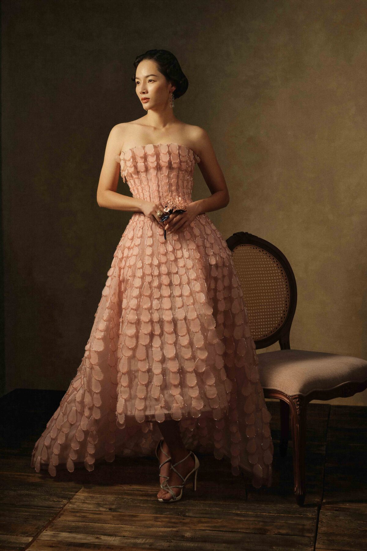 Strapless blush pink ball gown with sculptural train