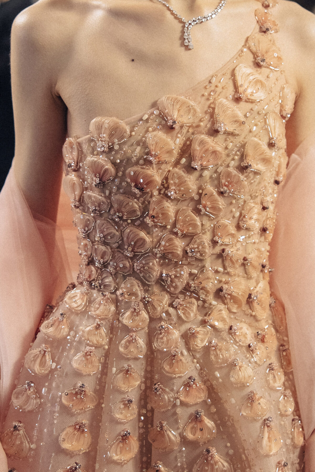One-shoulder blush pink ball gown with 3D floral appliqué
