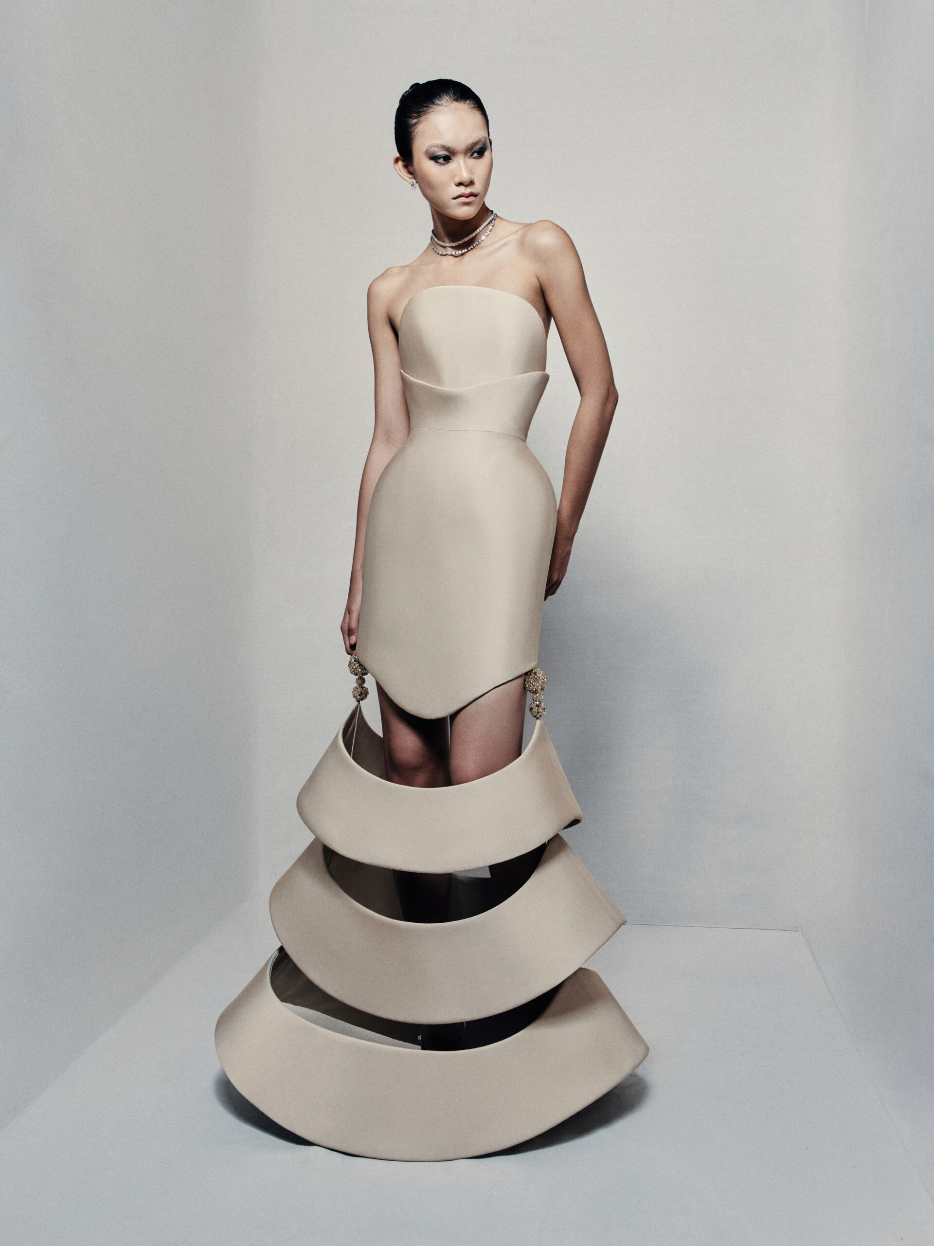 Strapless sculptural mermaid gown in beige taffeta