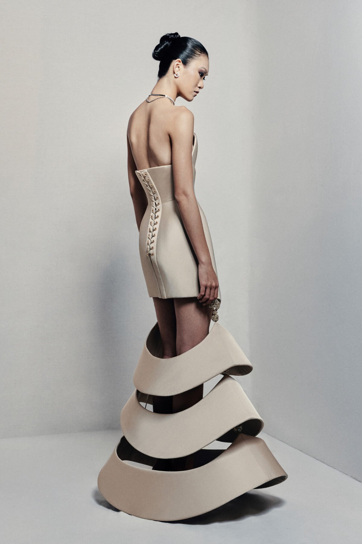 Strapless sculptural mermaid gown in beige taffeta