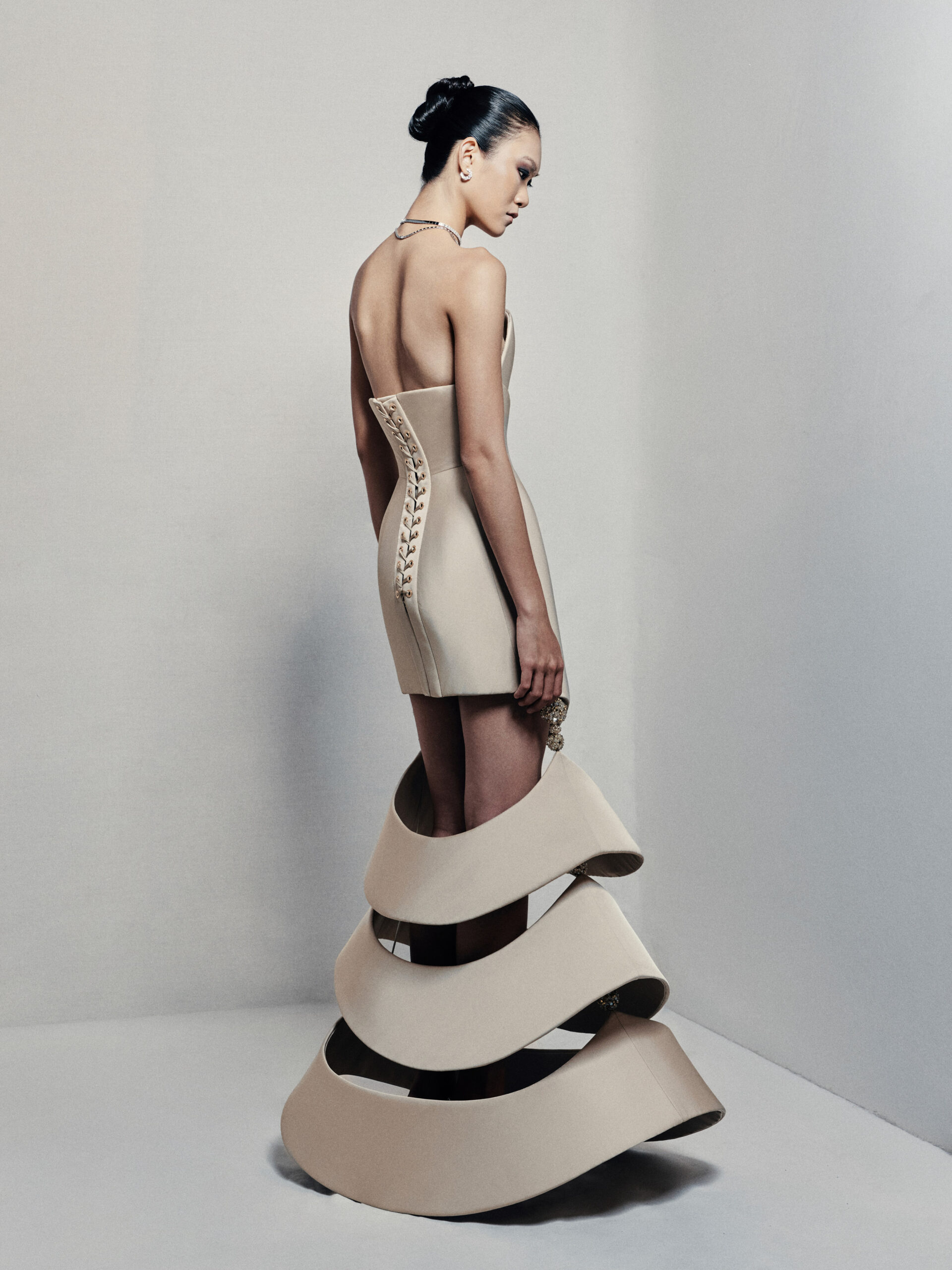 Strapless sculptural mermaid gown in beige taffeta