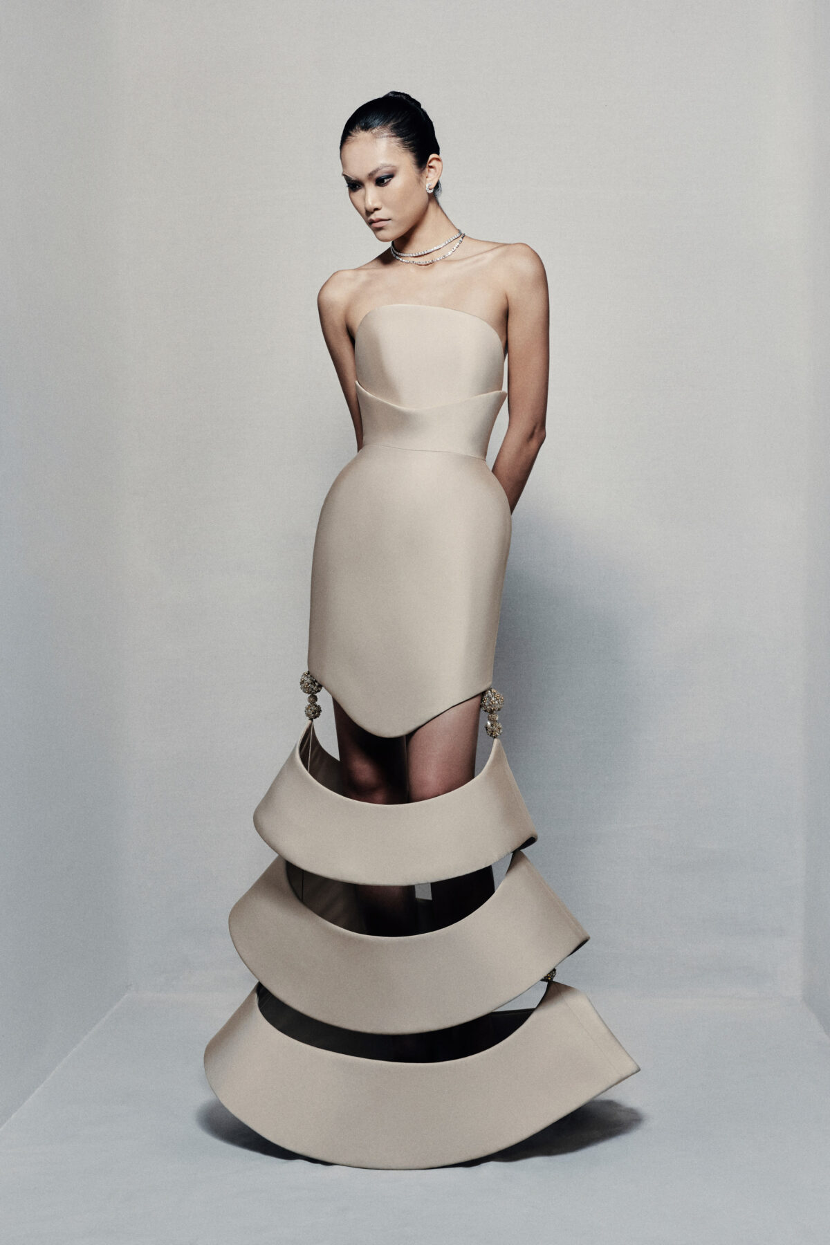 Strapless sculptural mermaid gown in beige taffeta