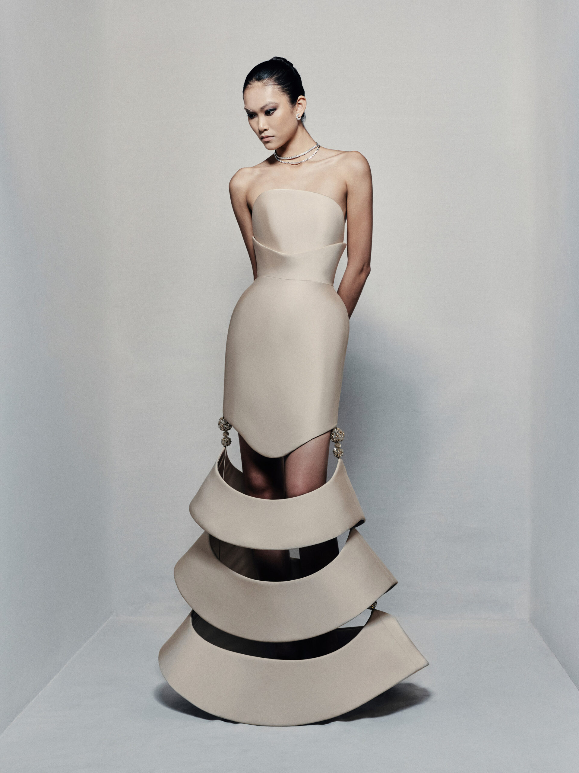 Strapless sculptural mermaid gown in beige taffeta