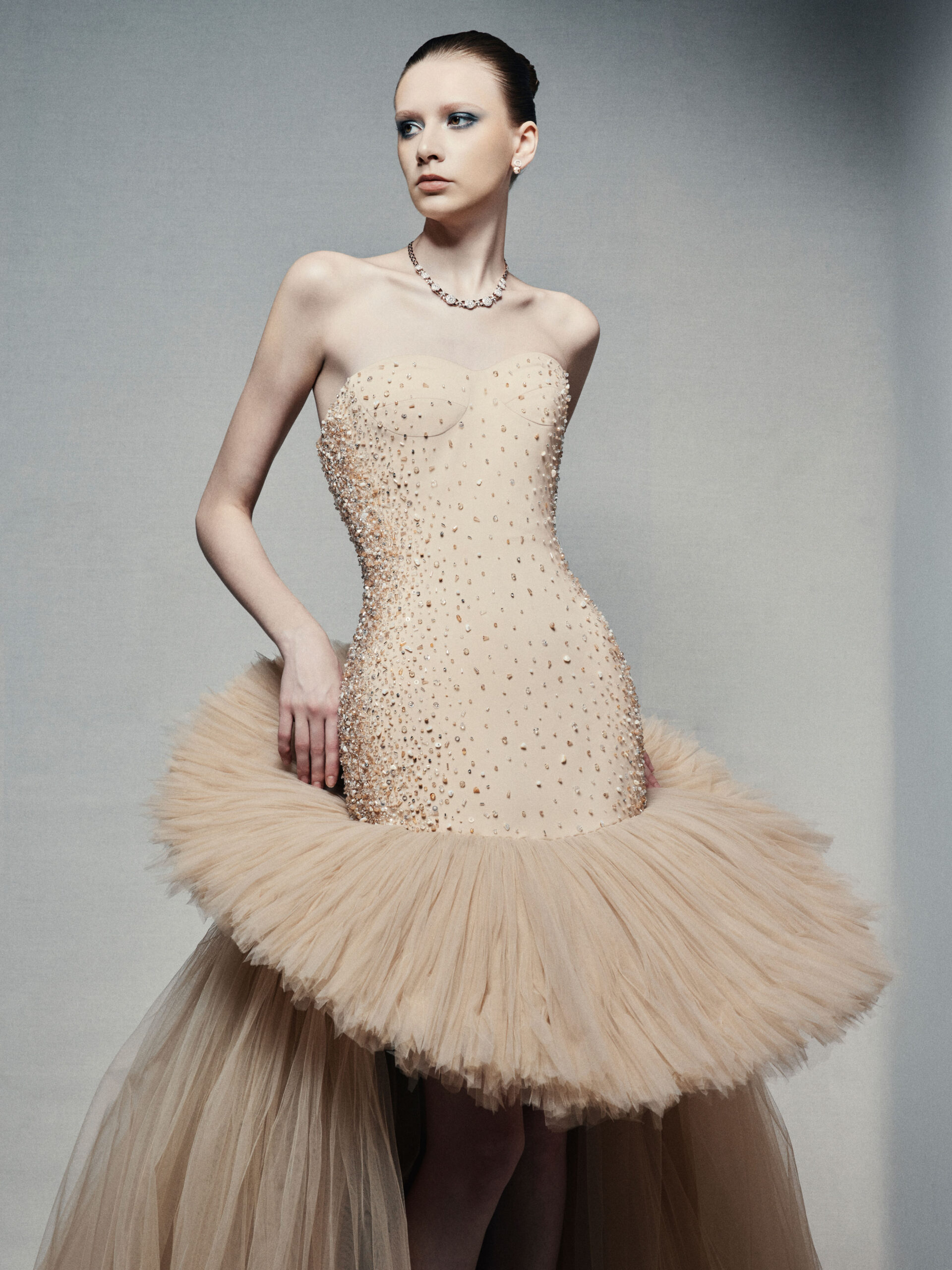 Strapless high-low ball gown in champagne