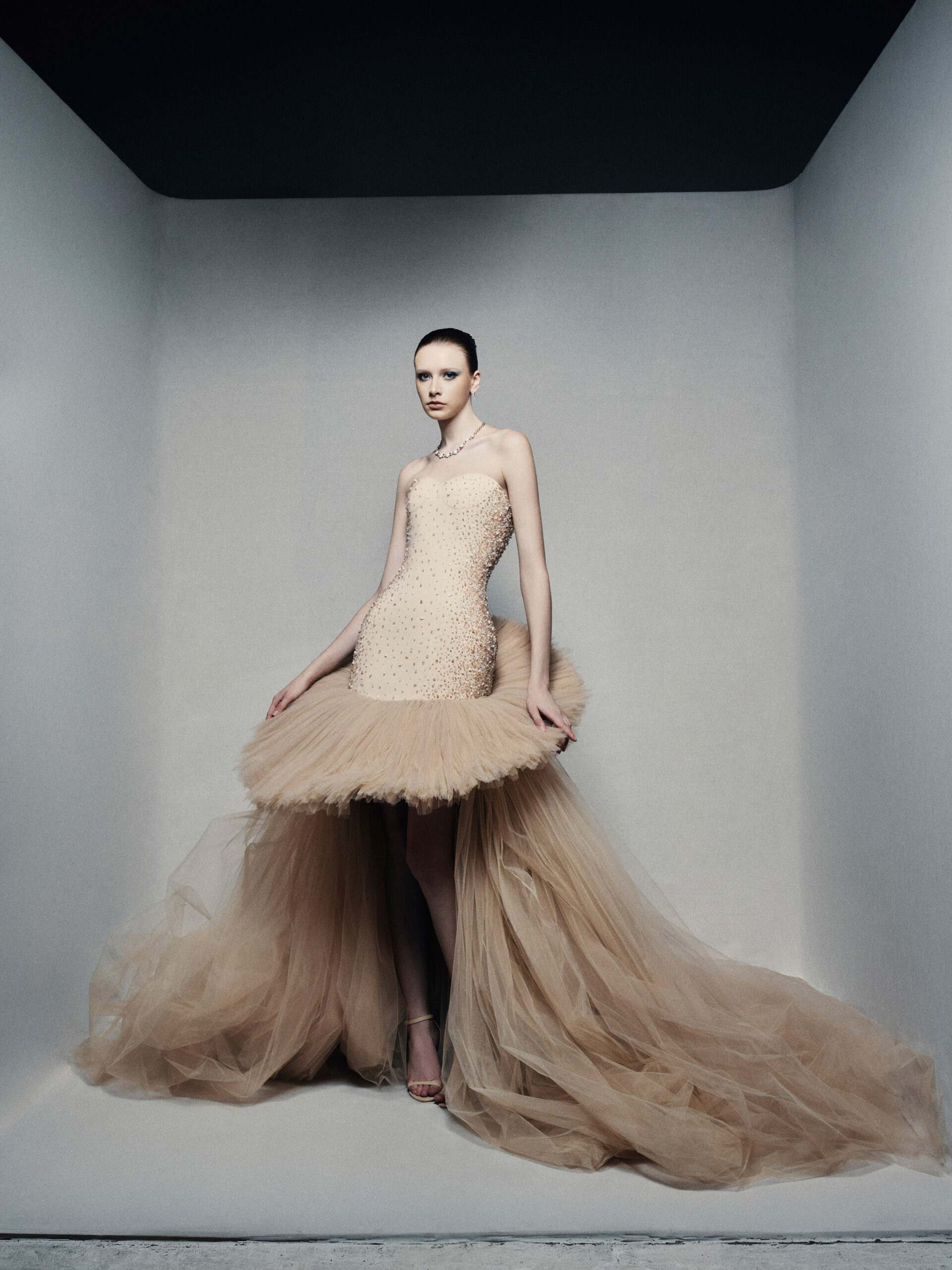 Strapless high-low ball gown in champagne