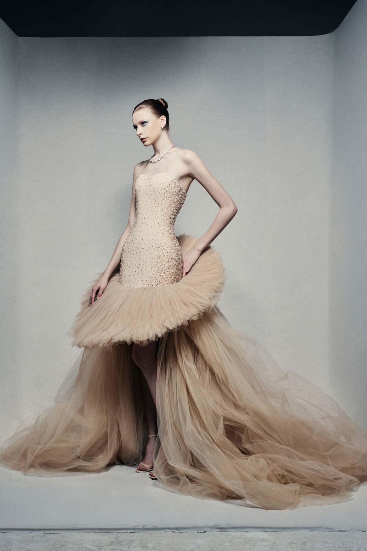 Strapless high-low ball gown in champagne