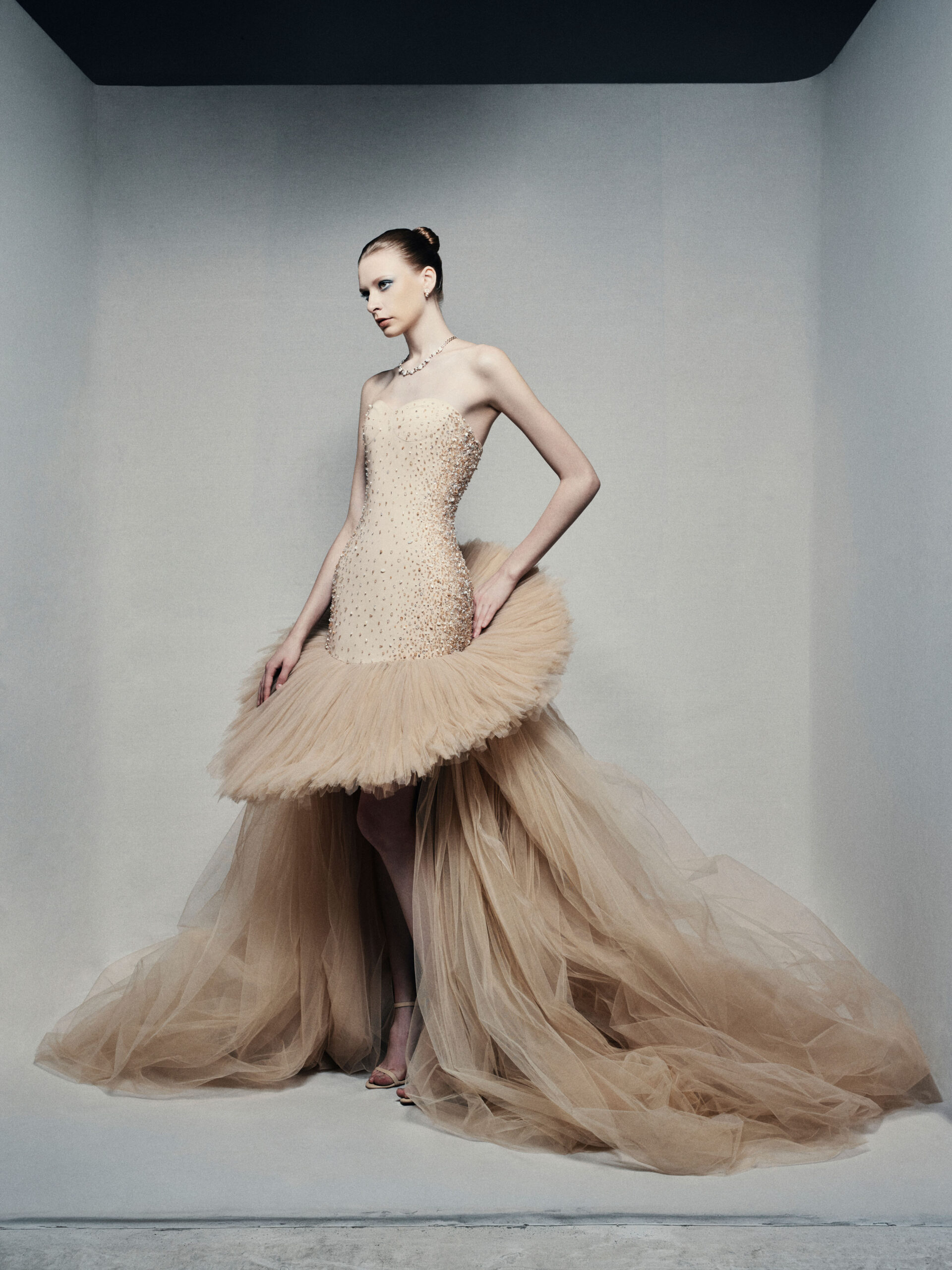 Strapless high-low ball gown in champagne