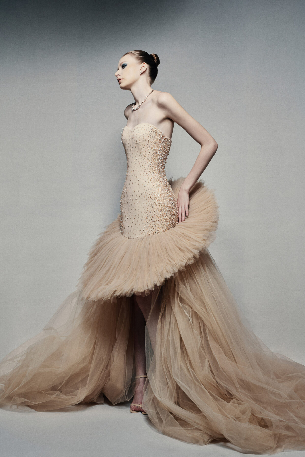Strapless high-low ball gown in champagne