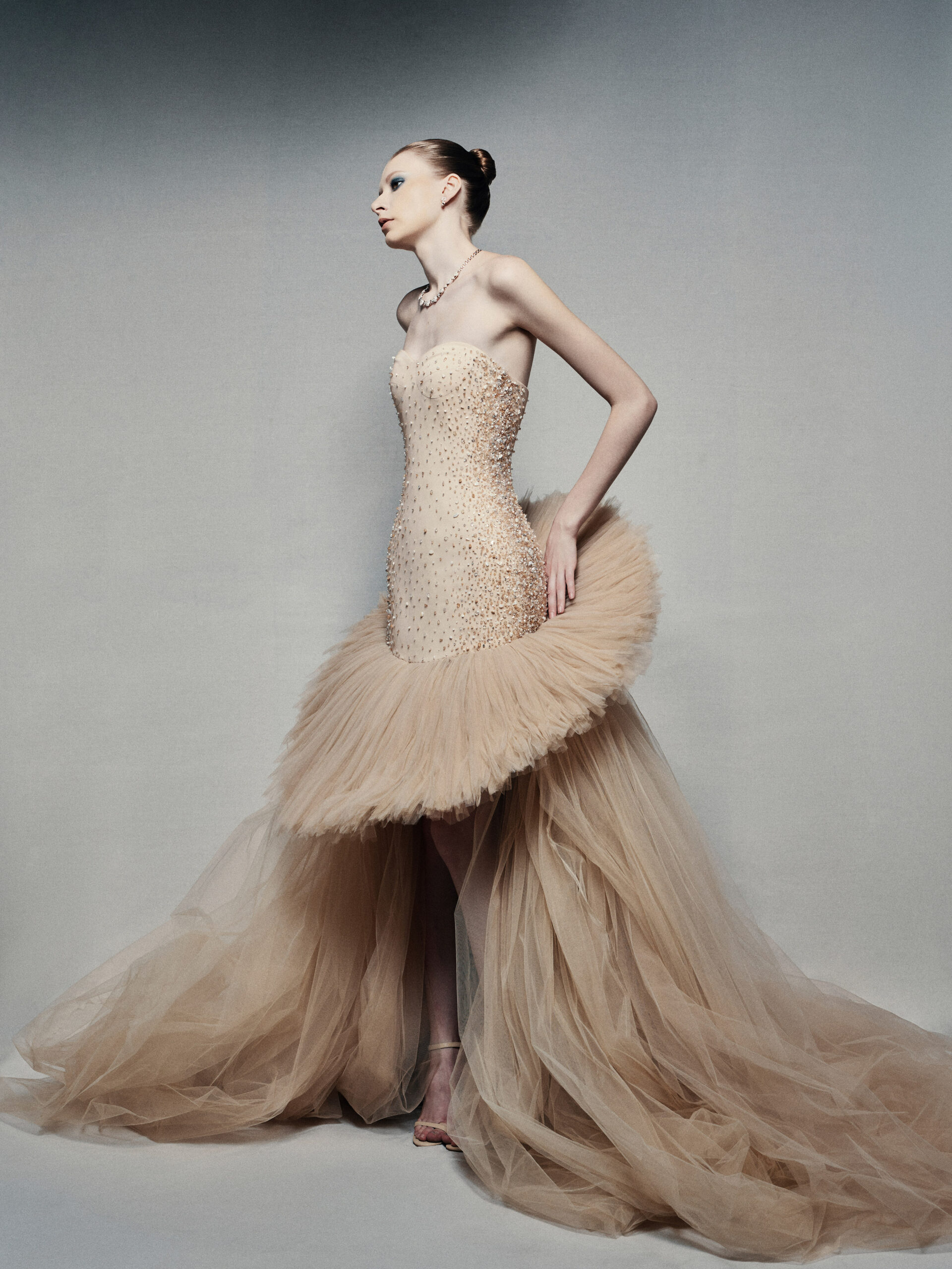 Strapless high-low ball gown in champagne
