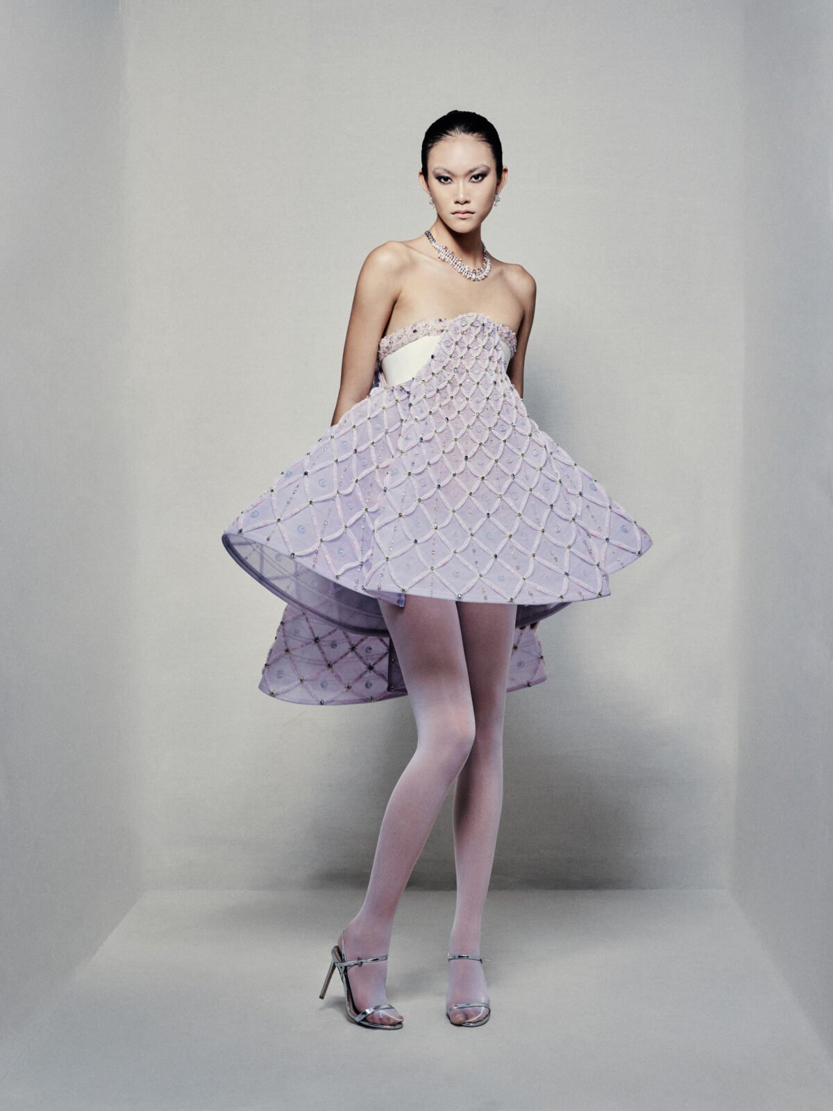 Strapless A-line babydoll dress with lavender high-low skirt