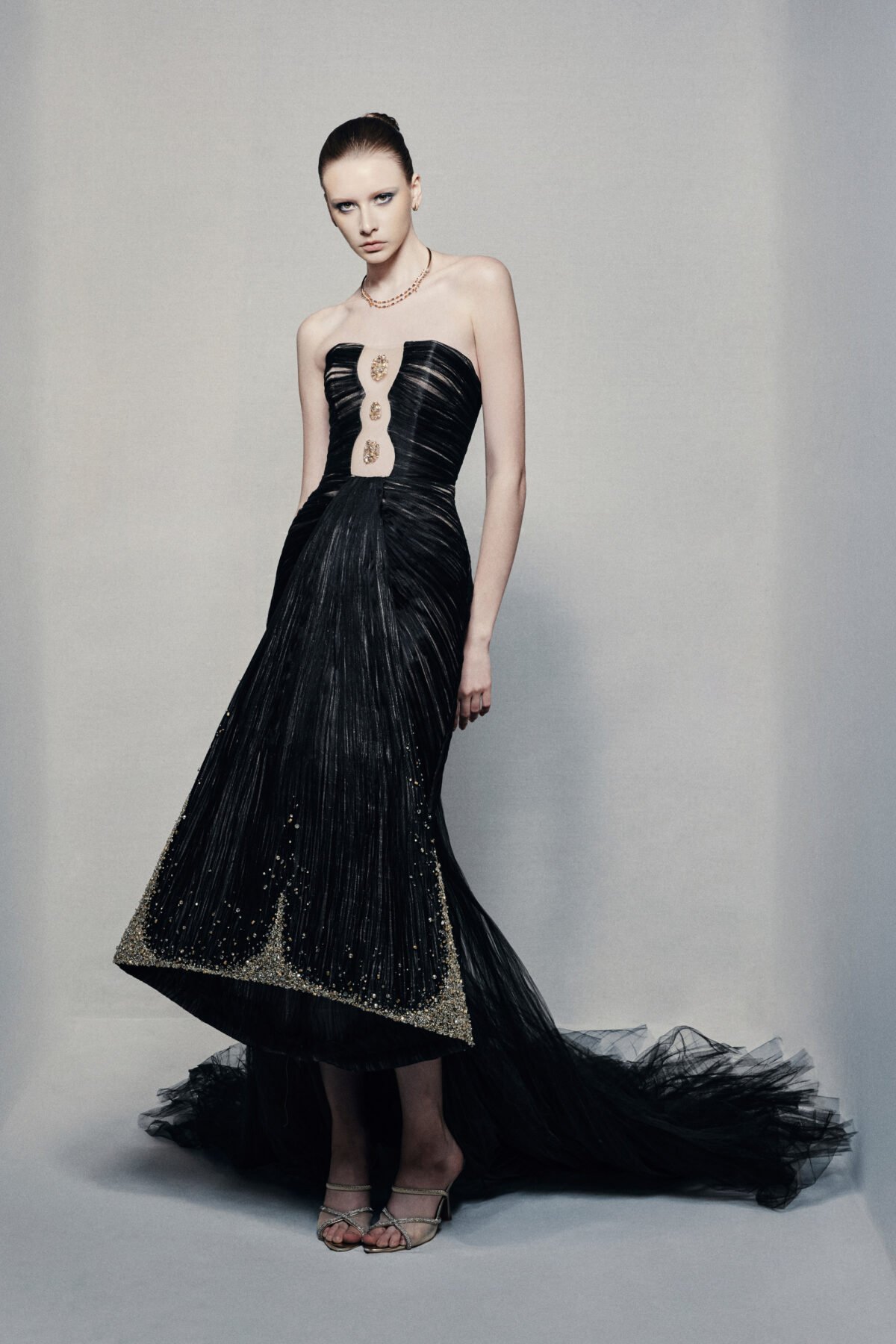 Black strapless mermaid gown with gold embellishments