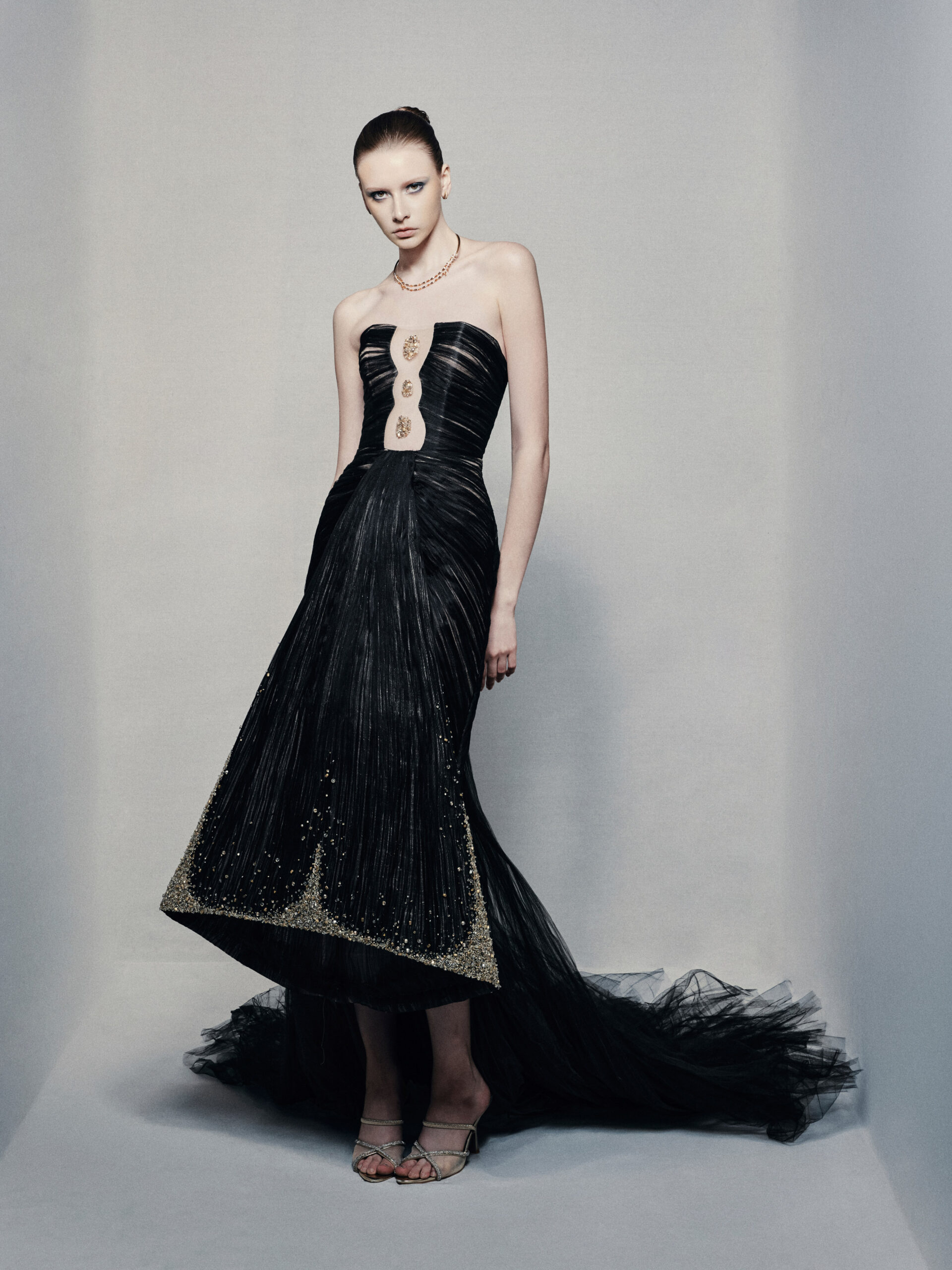Black strapless mermaid gown with gold embellishments