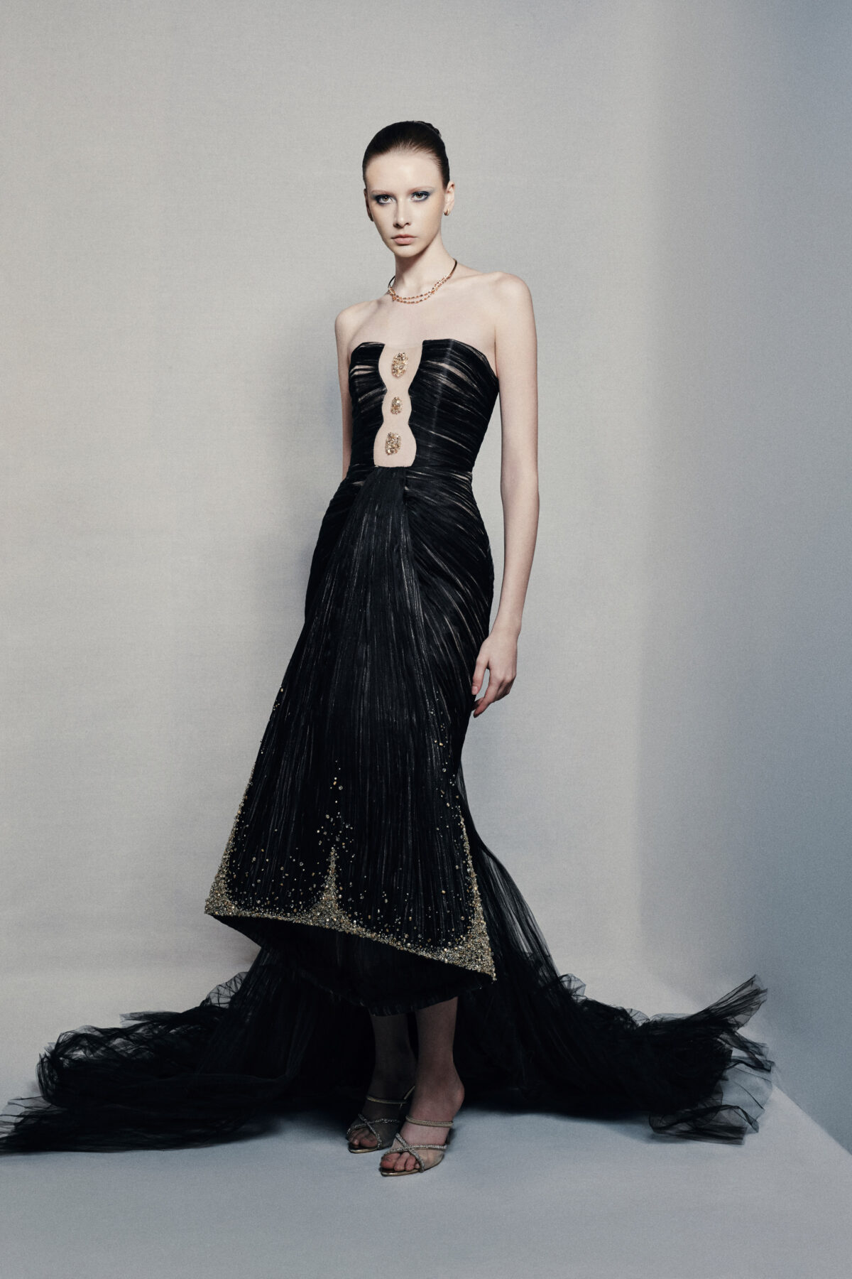 Black strapless mermaid gown with gold embellishments