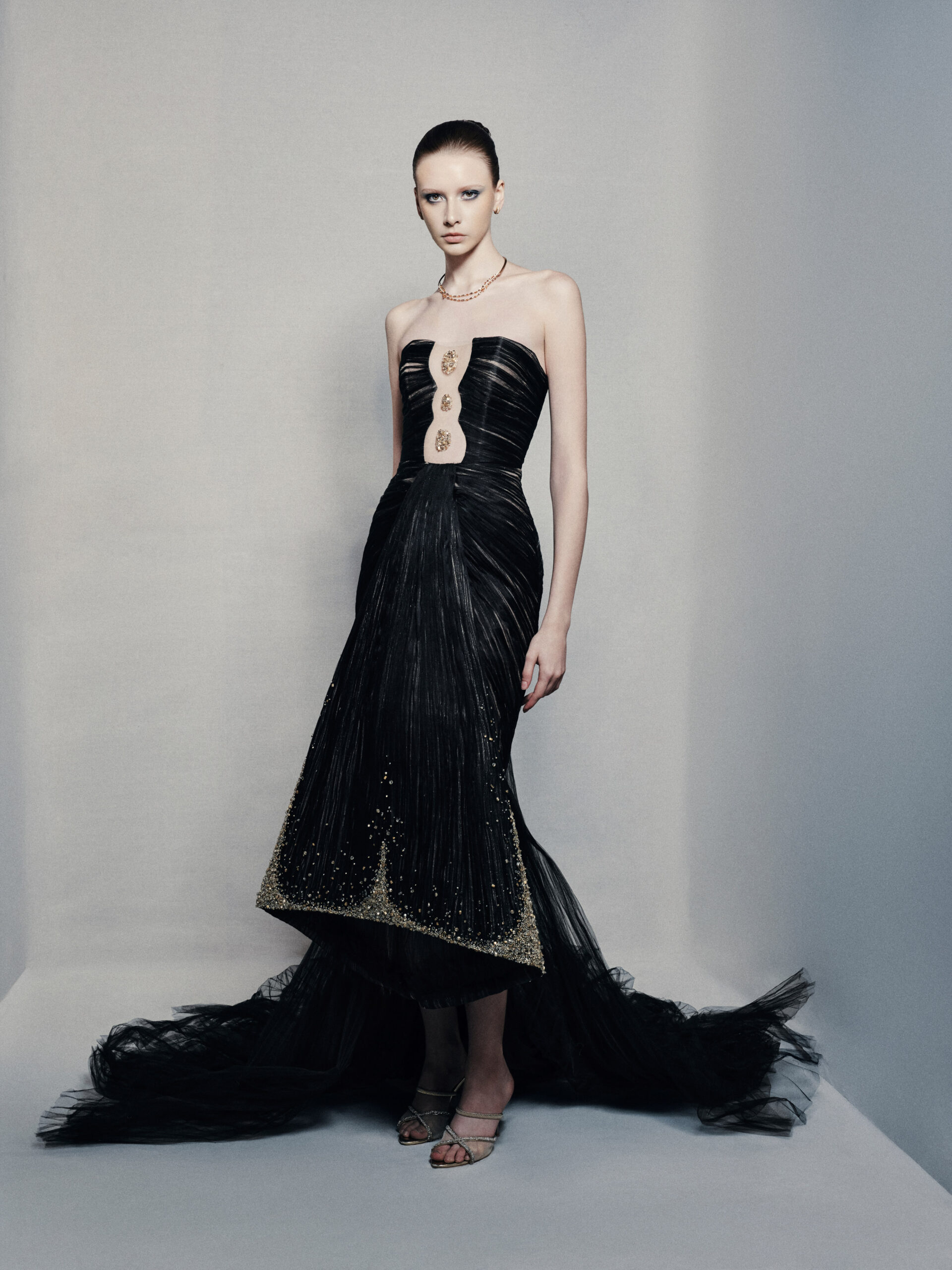 Black strapless mermaid gown with gold embellishments