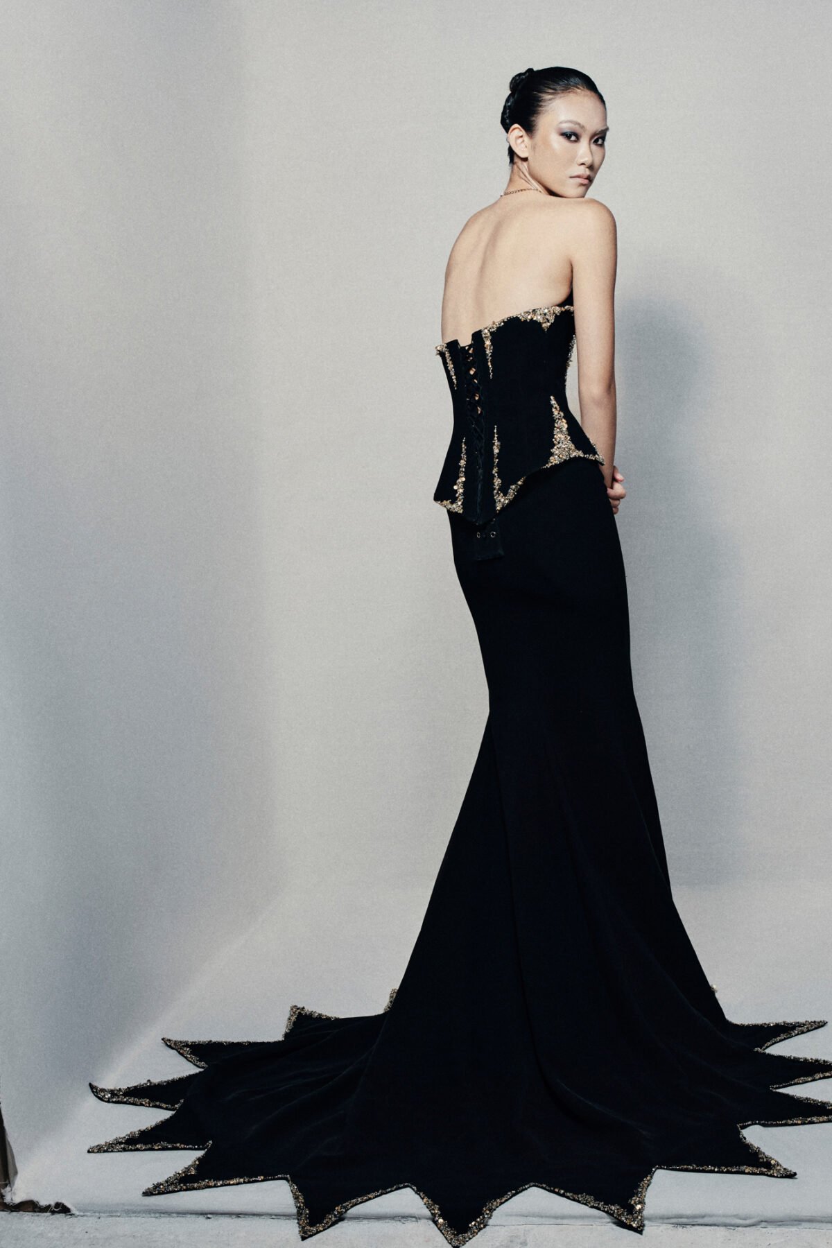 Black strapless fit and flare gown in crepe