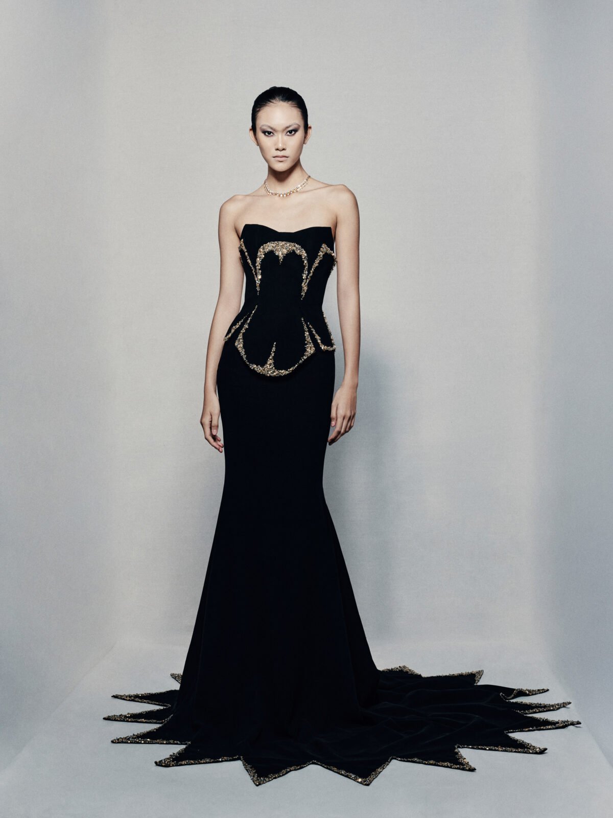 Black strapless fit and flare gown in crepe
