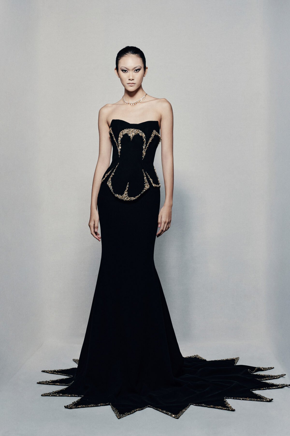 Black strapless fit and flare gown in crepe