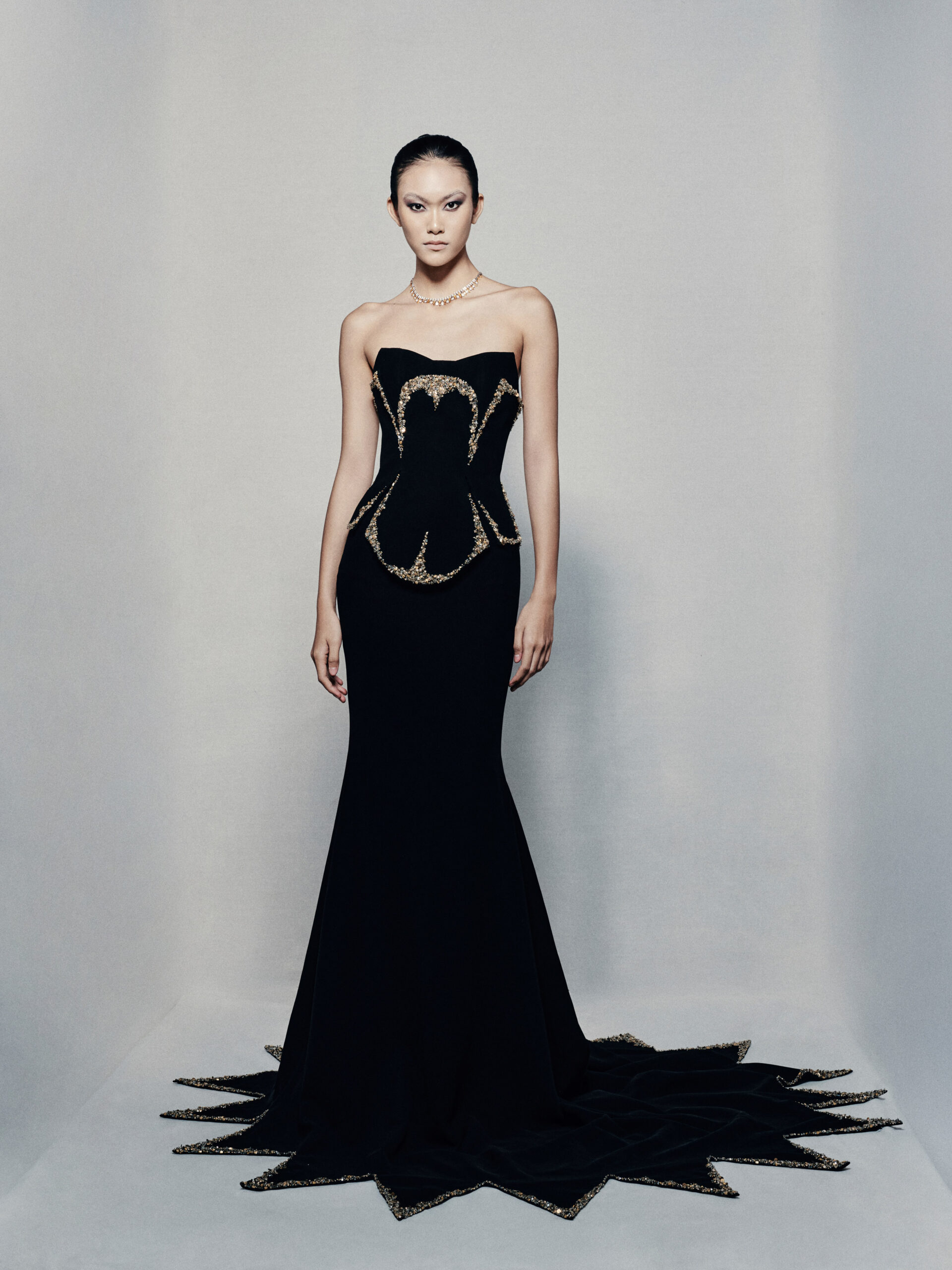 Black strapless fit and flare gown in crepe