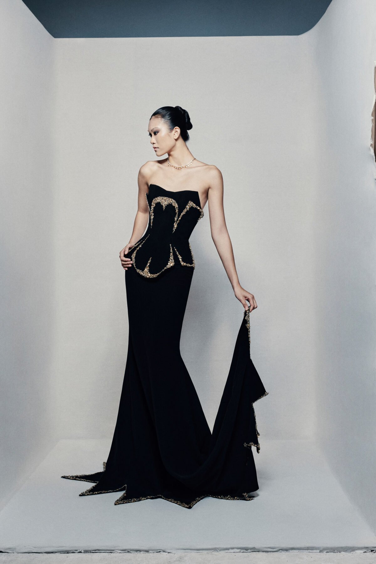 Black strapless fit and flare gown in crepe