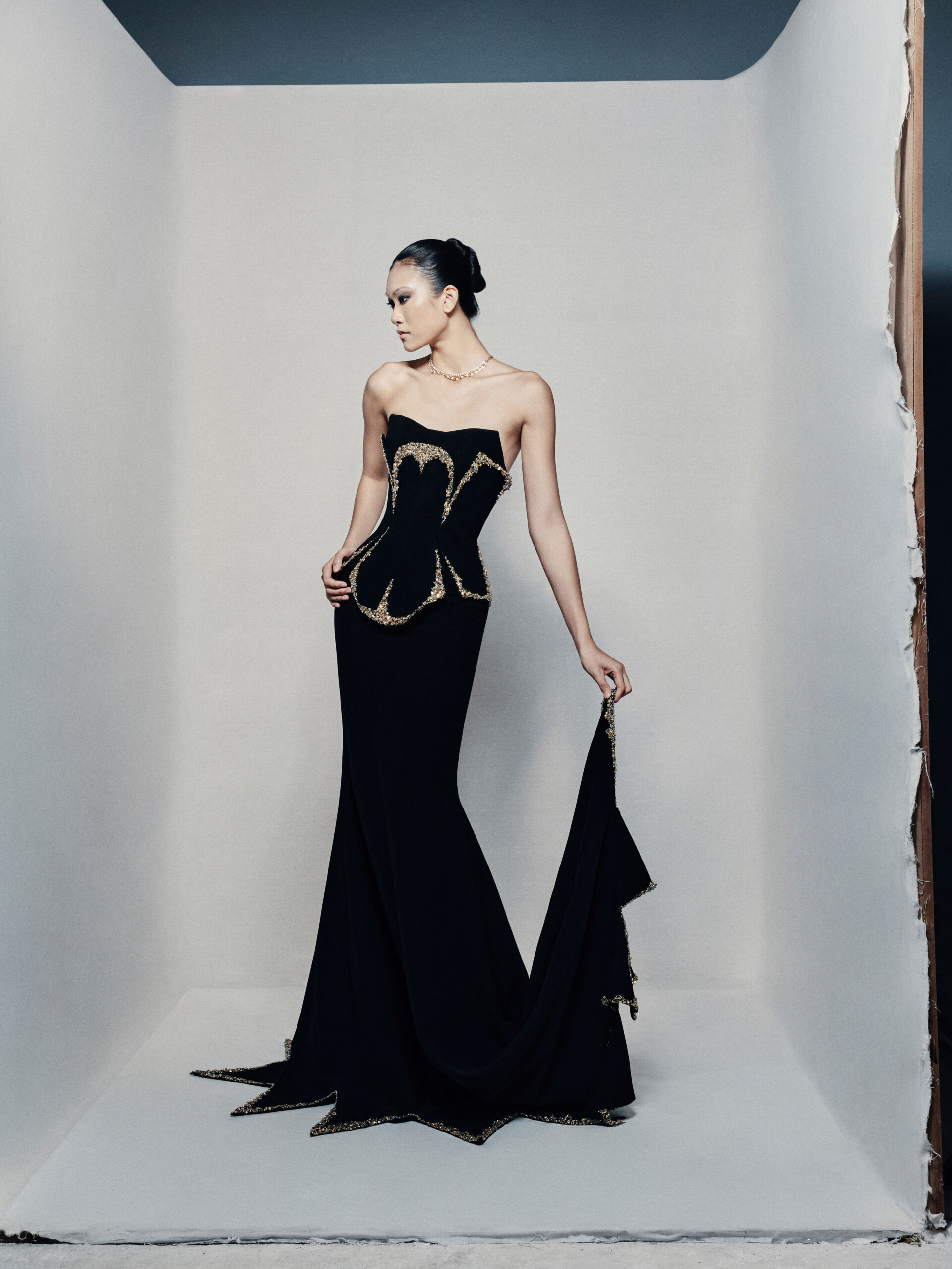 Black strapless fit and flare gown in crepe