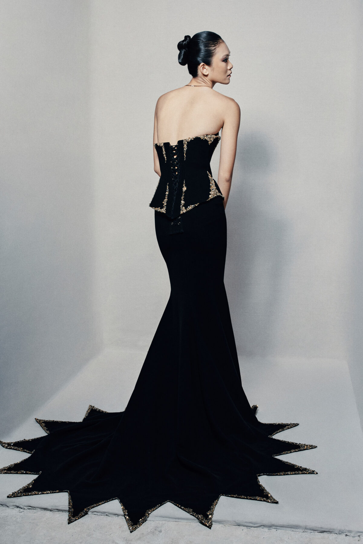 Black strapless fit and flare gown in crepe