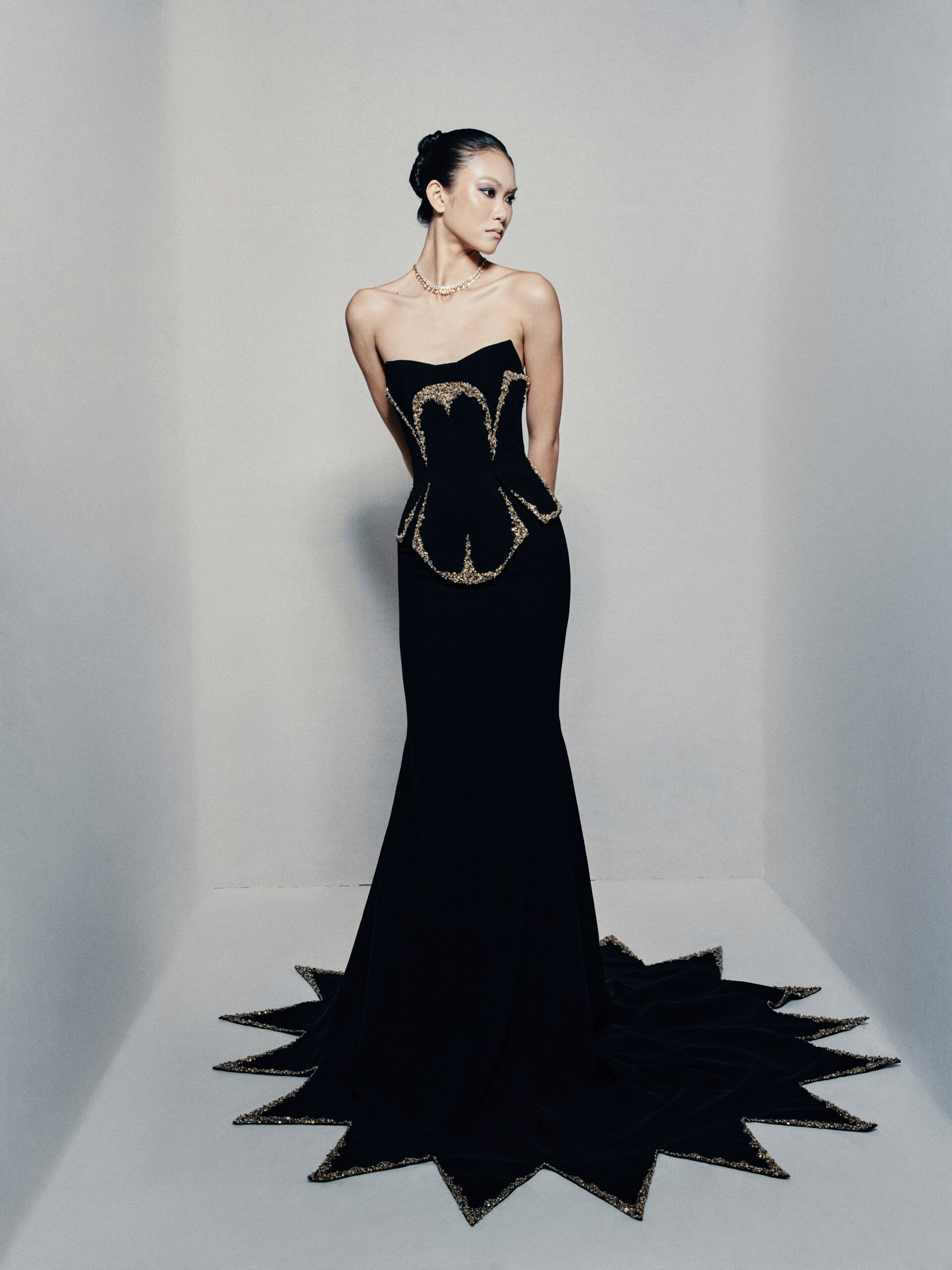 Black strapless fit and flare gown in crepe