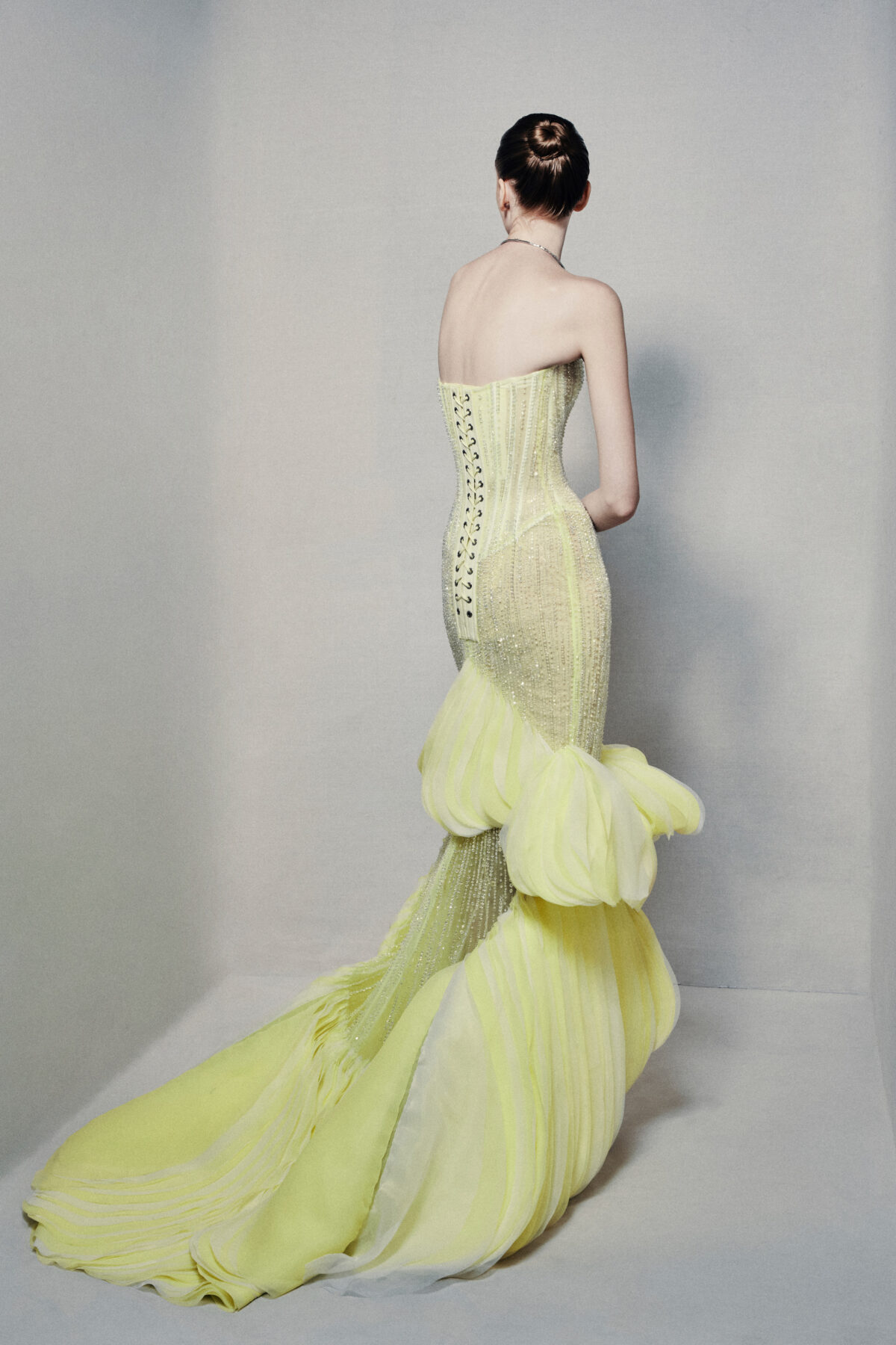 Semi-sheer strapless mermaid gown in lime yellow