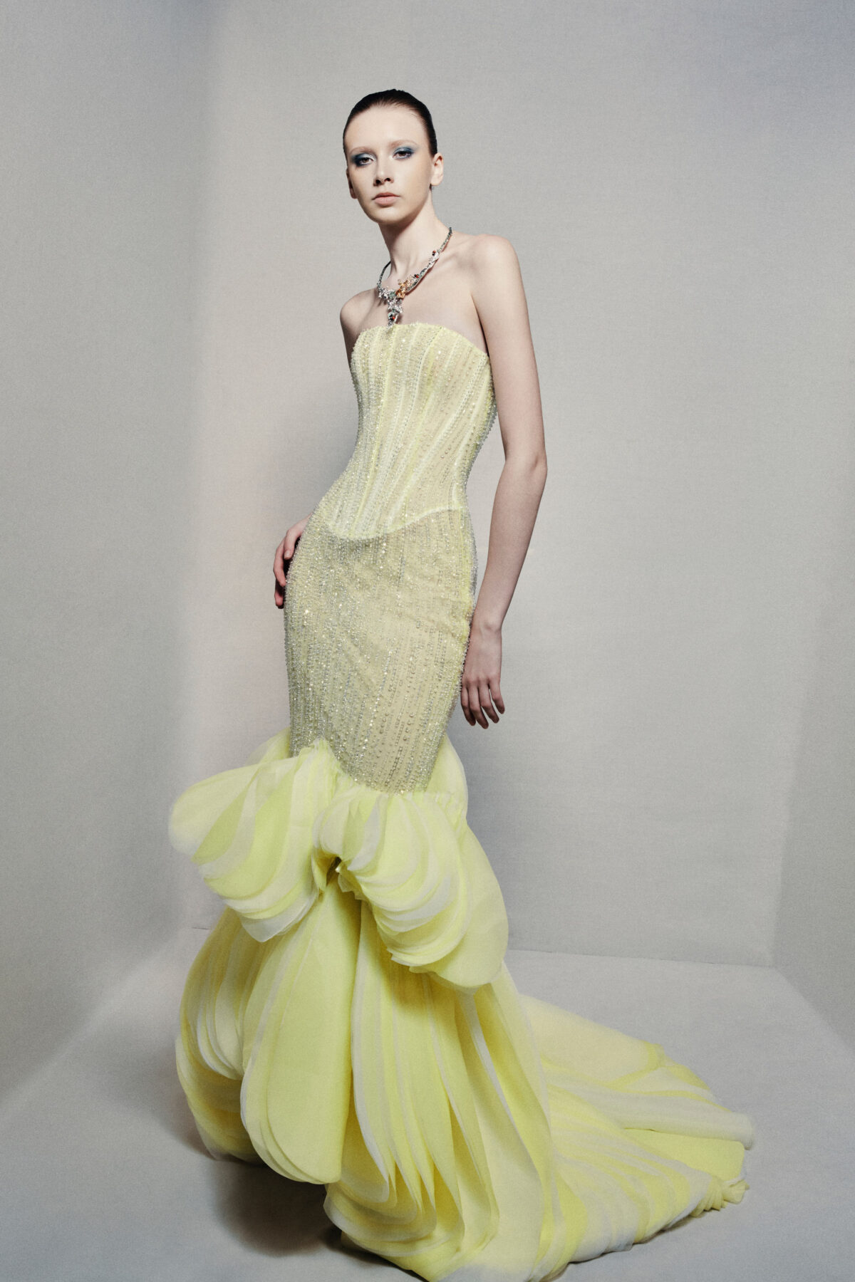 Semi-sheer strapless mermaid gown in lime yellow