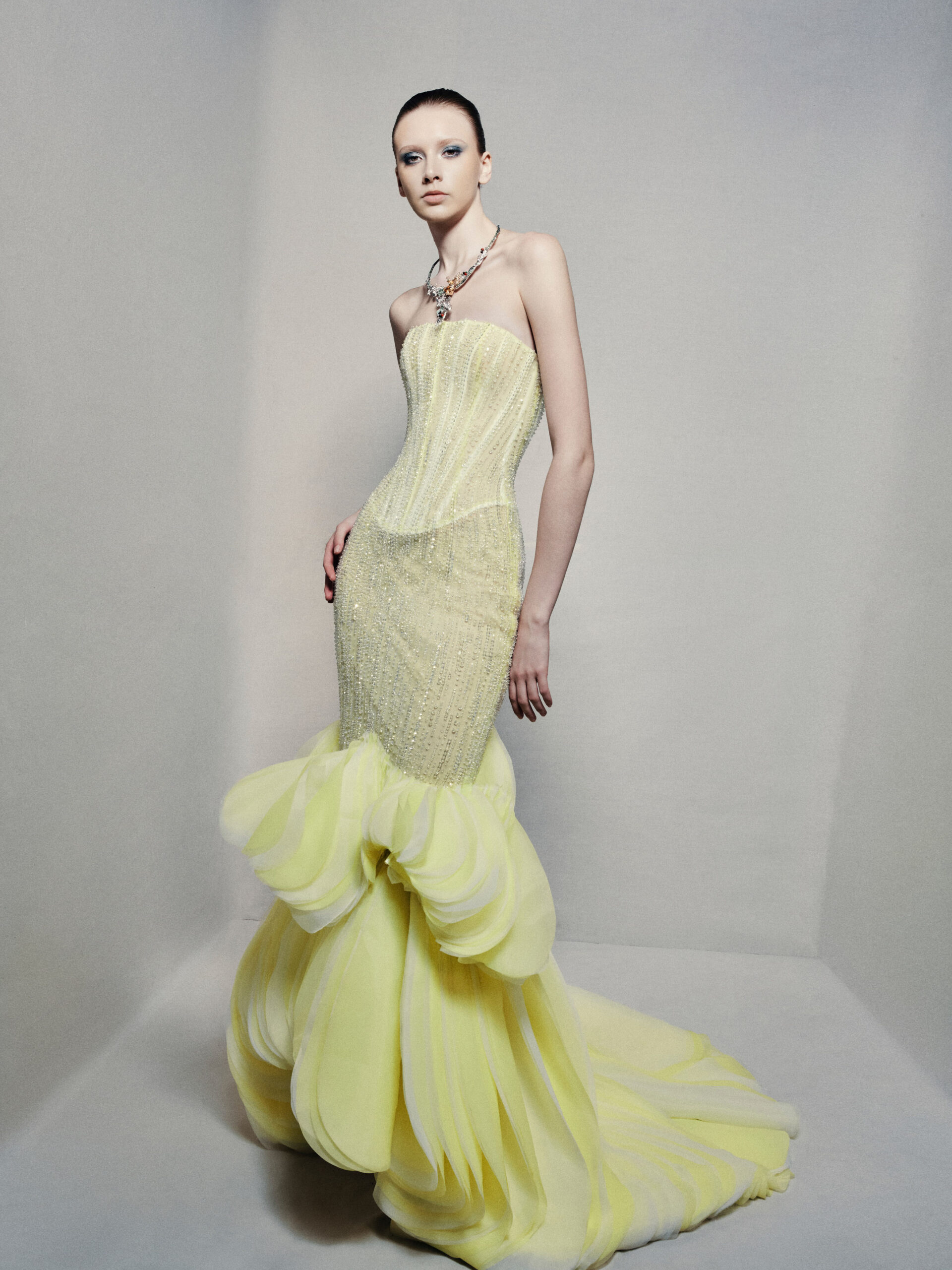 Semi-sheer strapless mermaid gown in lime yellow