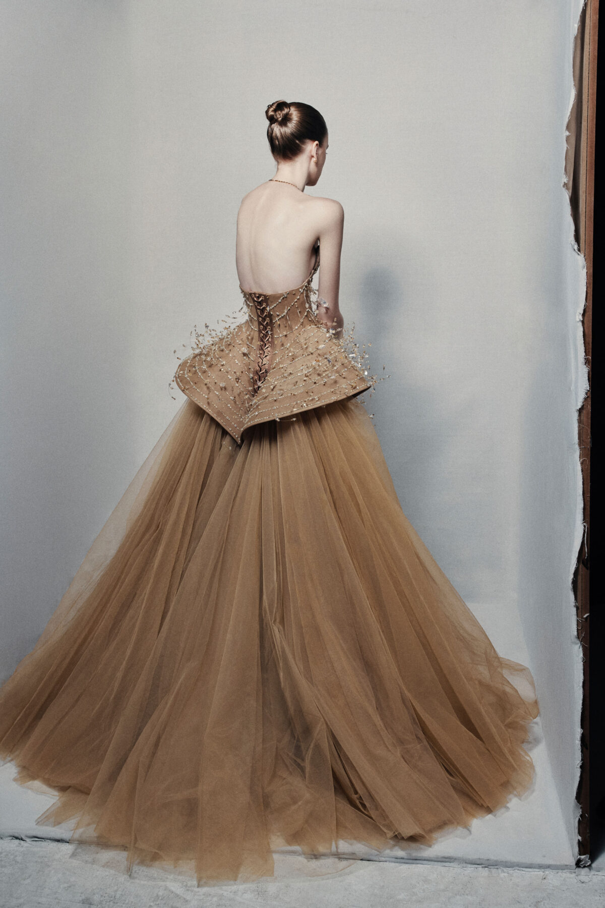 Strapless bronze ball gown with cascading chain beadwork