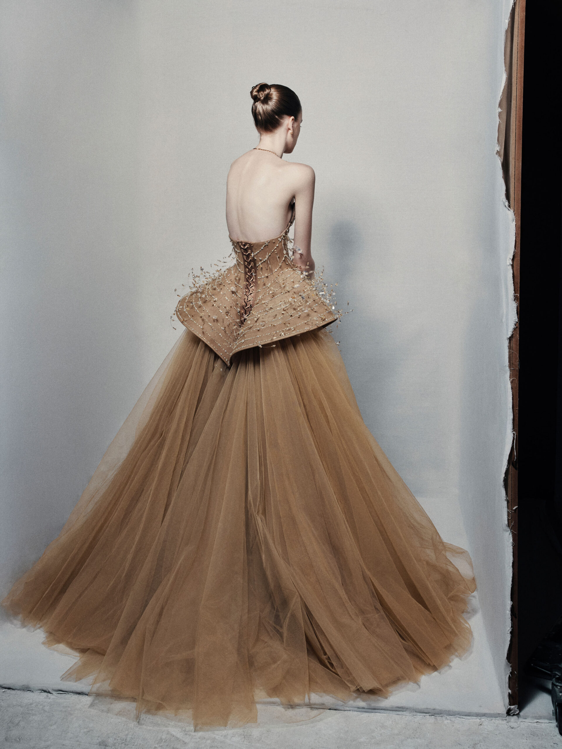 Strapless bronze ball gown with cascading chain beadwork