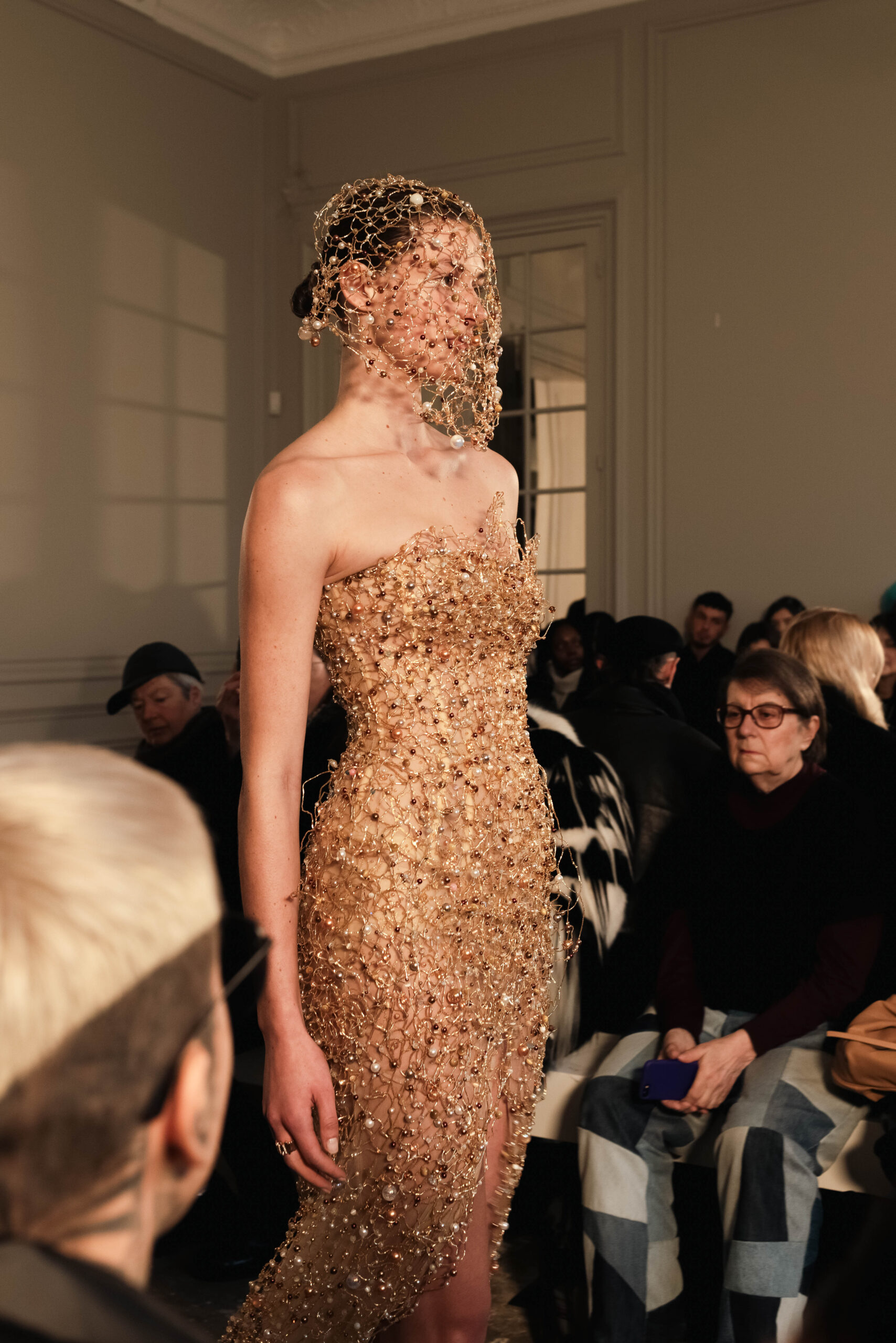 Strapless slit mermaid gown in metallic gold