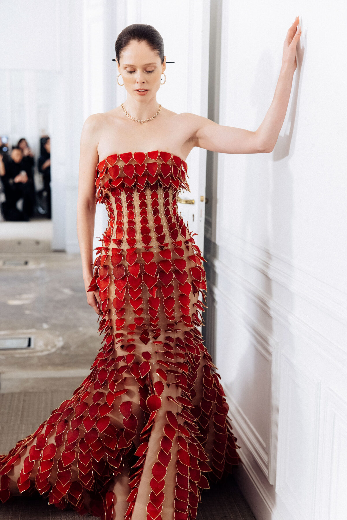 Strapless floor-length trumpet gown with crimson chiffon leaves