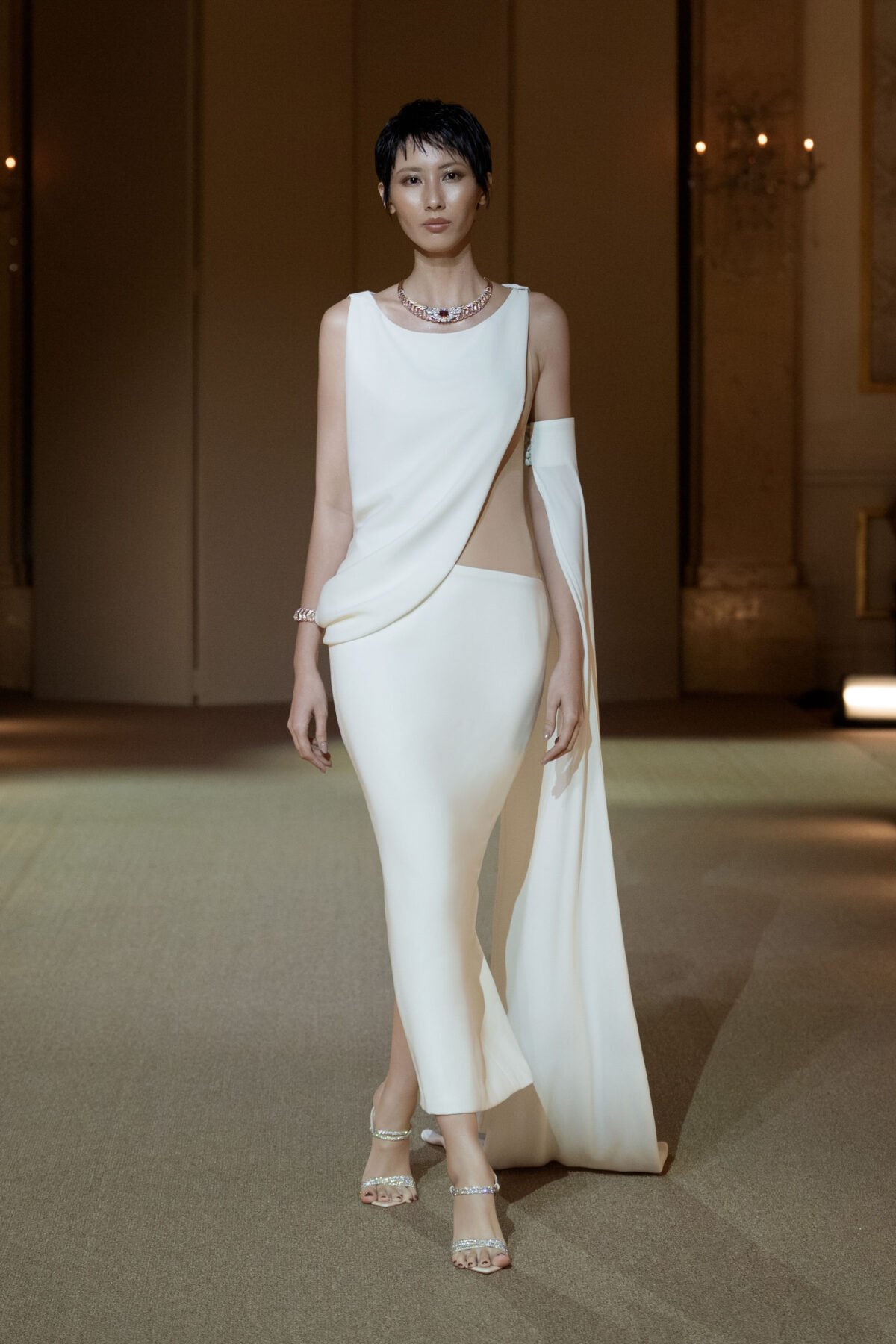 Cream asymmetrical mermaid gown with draped cape by PHAN HUY