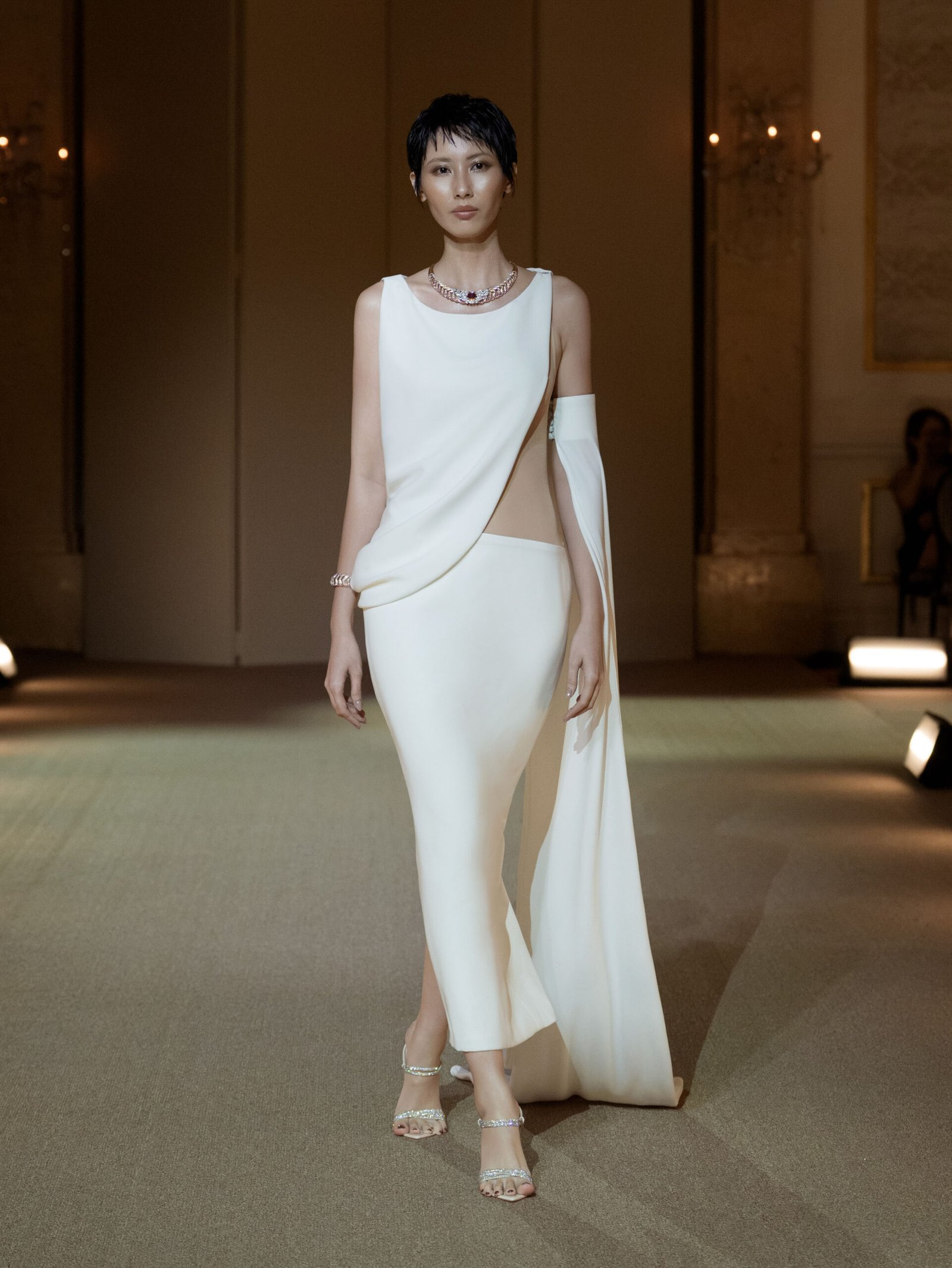 Cream asymmetrical mermaid gown with draped cape by PHAN HUY
