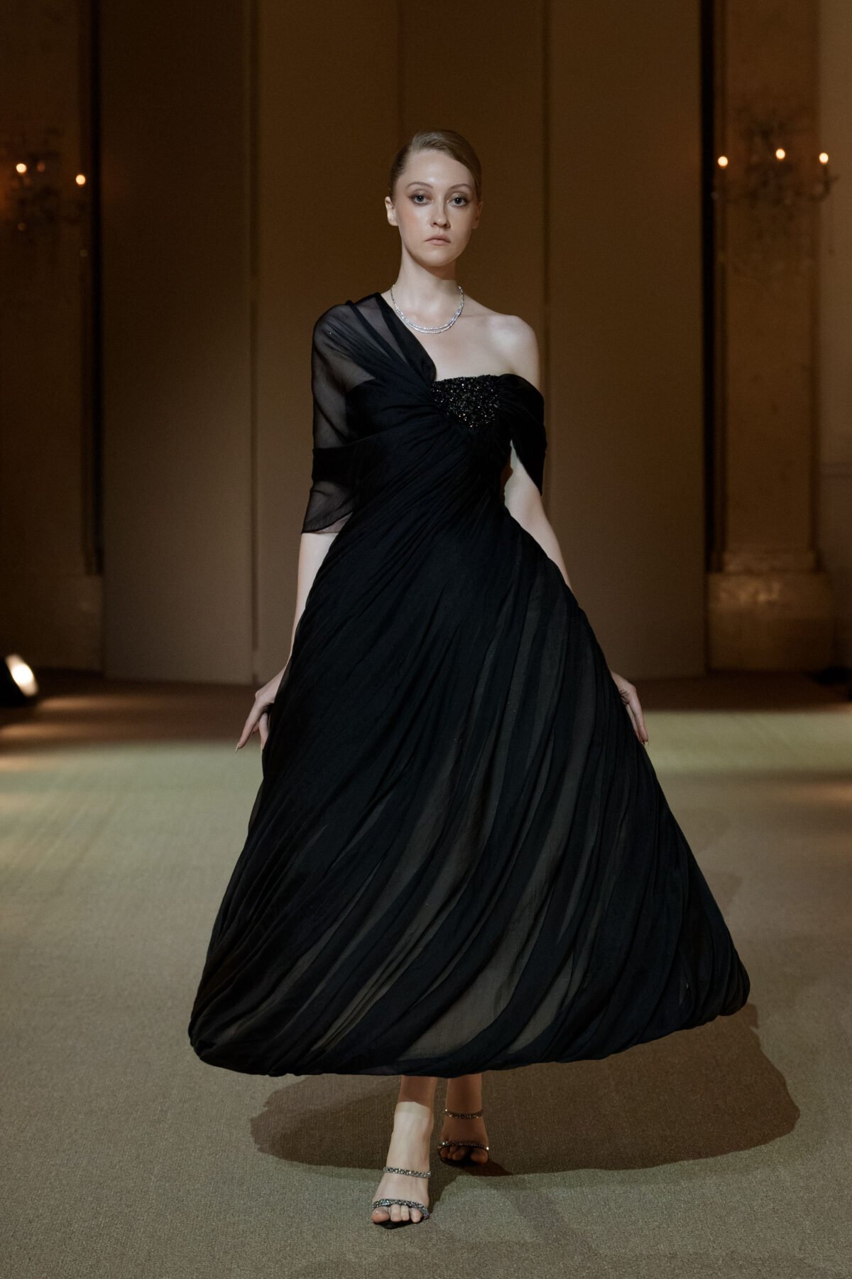 Black asymmetrical A-line dress with beaded bust by PHAN HUY