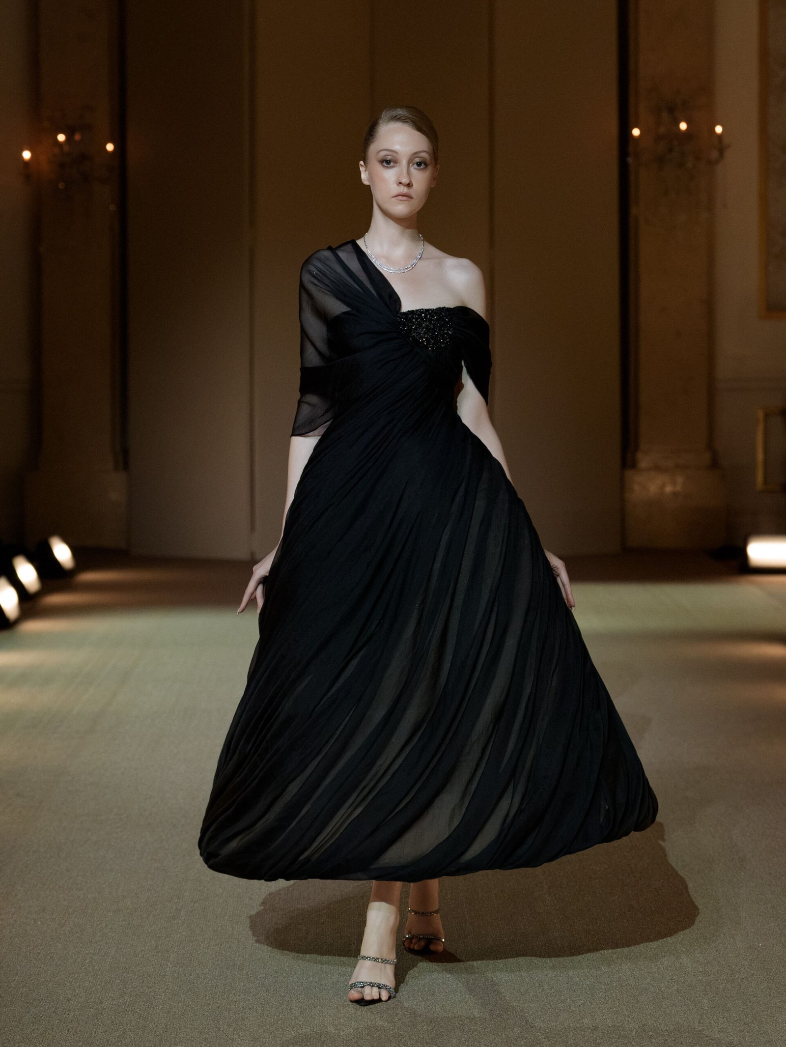 Black asymmetrical A-line dress with beaded bust by PHAN HUY