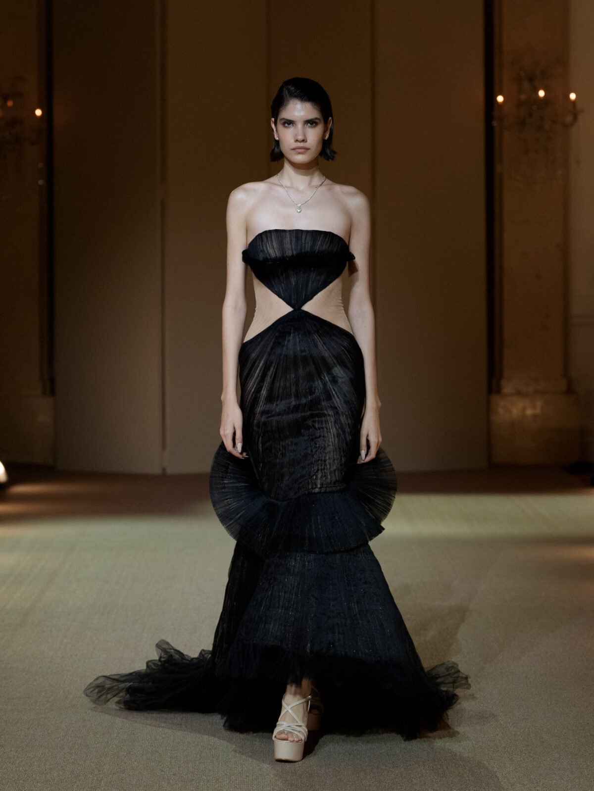 Black strapless mermaid gown with midriff cut-out by PHAN HUY