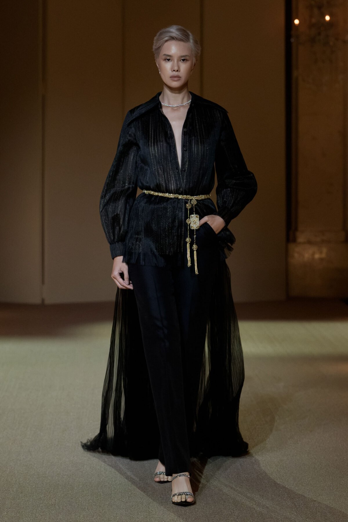 Black evening ensemble with hand-pleated semi-sheer blouse and boot-cut trousers