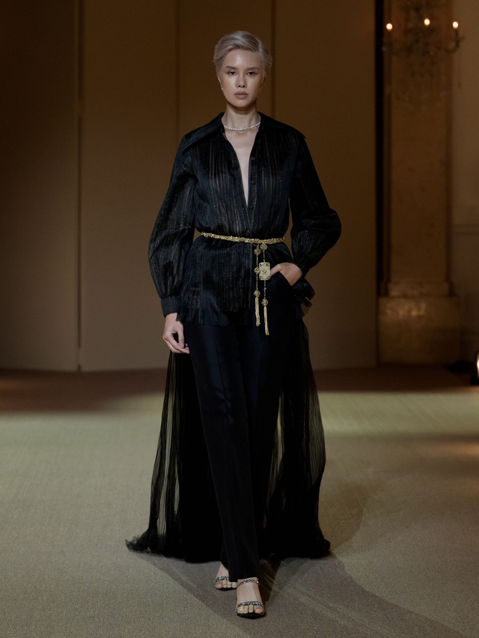 Black evening ensemble with hand-pleated semi-sheer blouse and boot-cut trousers