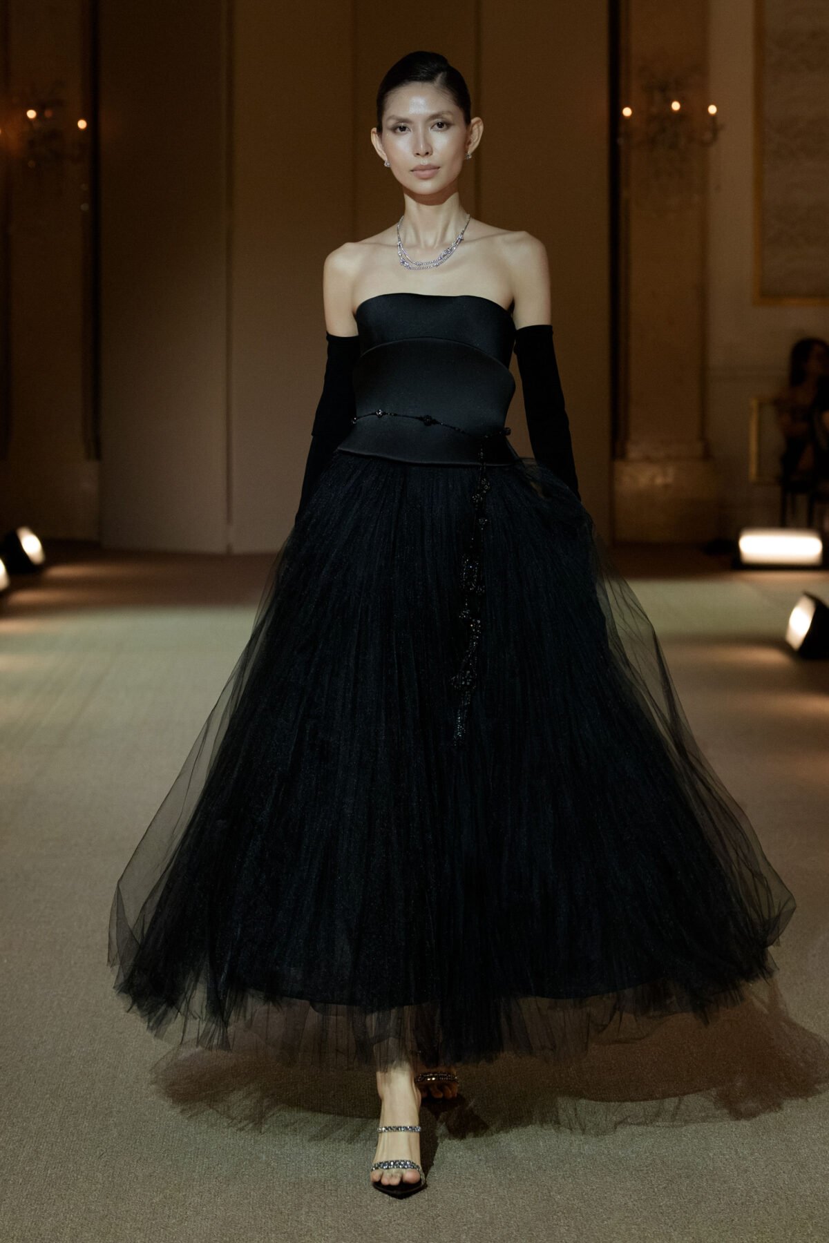 Black strapless A-line dress with a hand-pleated knee-length tulle skirt