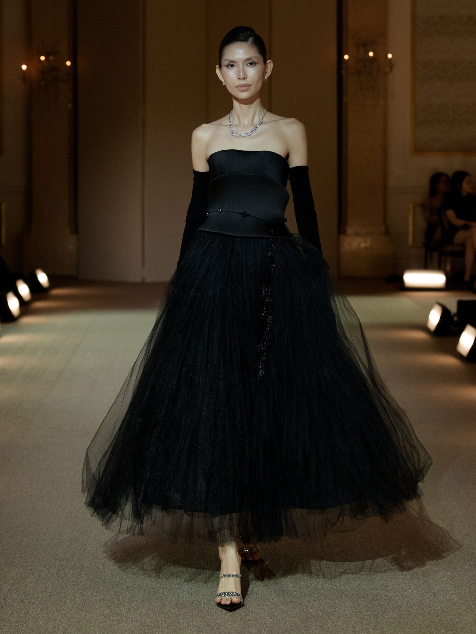 Black strapless A-line dress with a hand-pleated knee-length tulle skirt