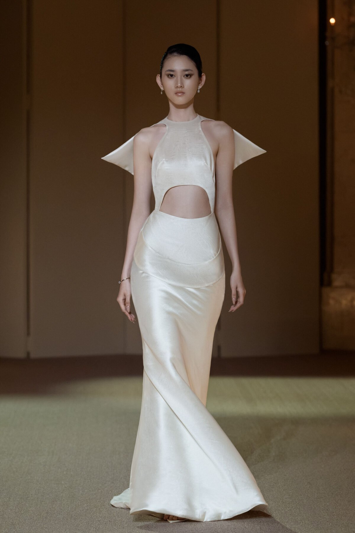 Ivory white halterneck fit-and-flare gown with sculptural cut-out