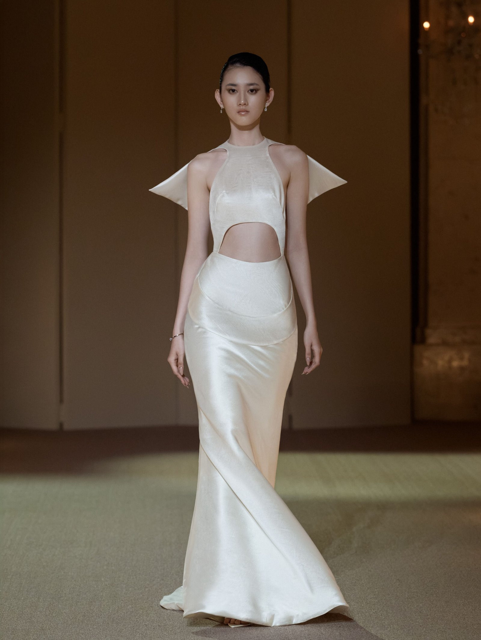 Ivory white halterneck fit-and-flare gown with sculptural cut-out